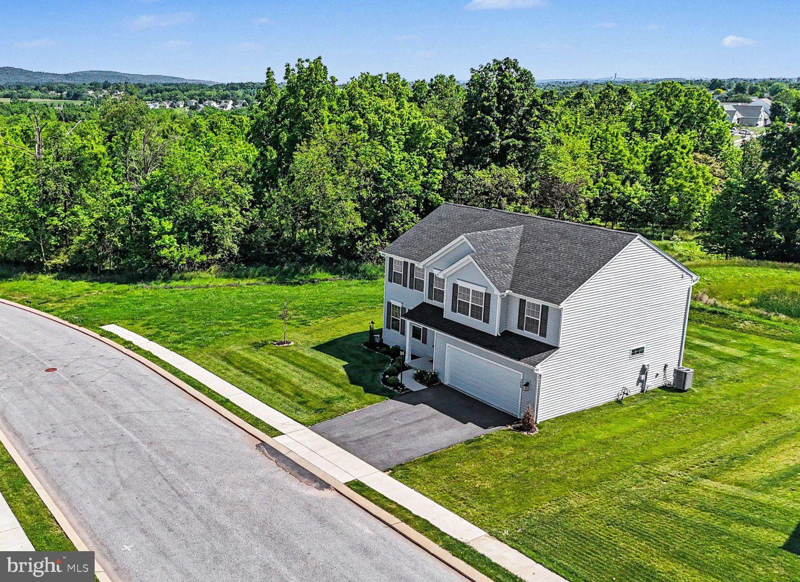 The best lot in The Seasons is finally available! Nestled on arguably the premier homesite in The Seasons, this nearly new 2-year-old home offers a level of privacy and setting that simply cannot be replicated within the community. Tucked away at the very end of Pebble Run Drive, this exceptional corner location backs to the future edge of the development, meaning no additional homes are planned beyond this section of the neighborhood. The result is a rare combination of neighborhood living and peaceful seclusion, giving homeowners extra breathing room, less traffic, and a setting that will remain protected for years to come. As one of the largest homes and one of the largest floorplans built within the community, this property provides the space buyers are searching for while enjoying one of the most desirable locations available. The Seasons offers easy access to York, Harrisburg, Gettysburg, and Maryland while maintaining the quiet atmosphere that makes Dover such a sought-after destination. Inside, the thoughtfully designed floorplan offers over 2,500 square feet of living space, featuring 4 spacious bedrooms, 2.5 baths, a dedicated office, and expanded living areas that surpass many of the neighboring homes. The upgraded kitchen bump-out creates additional gathering space perfect for entertaining, while the open-concept design provides the flexibility today's buyers need. Whether you're looking for room to grow, work from home, or simply enjoy one of the best locations in the neighborhood, 3660 Pebble Run Drive delivers an opportunity that is rarely available in newer construction communities.