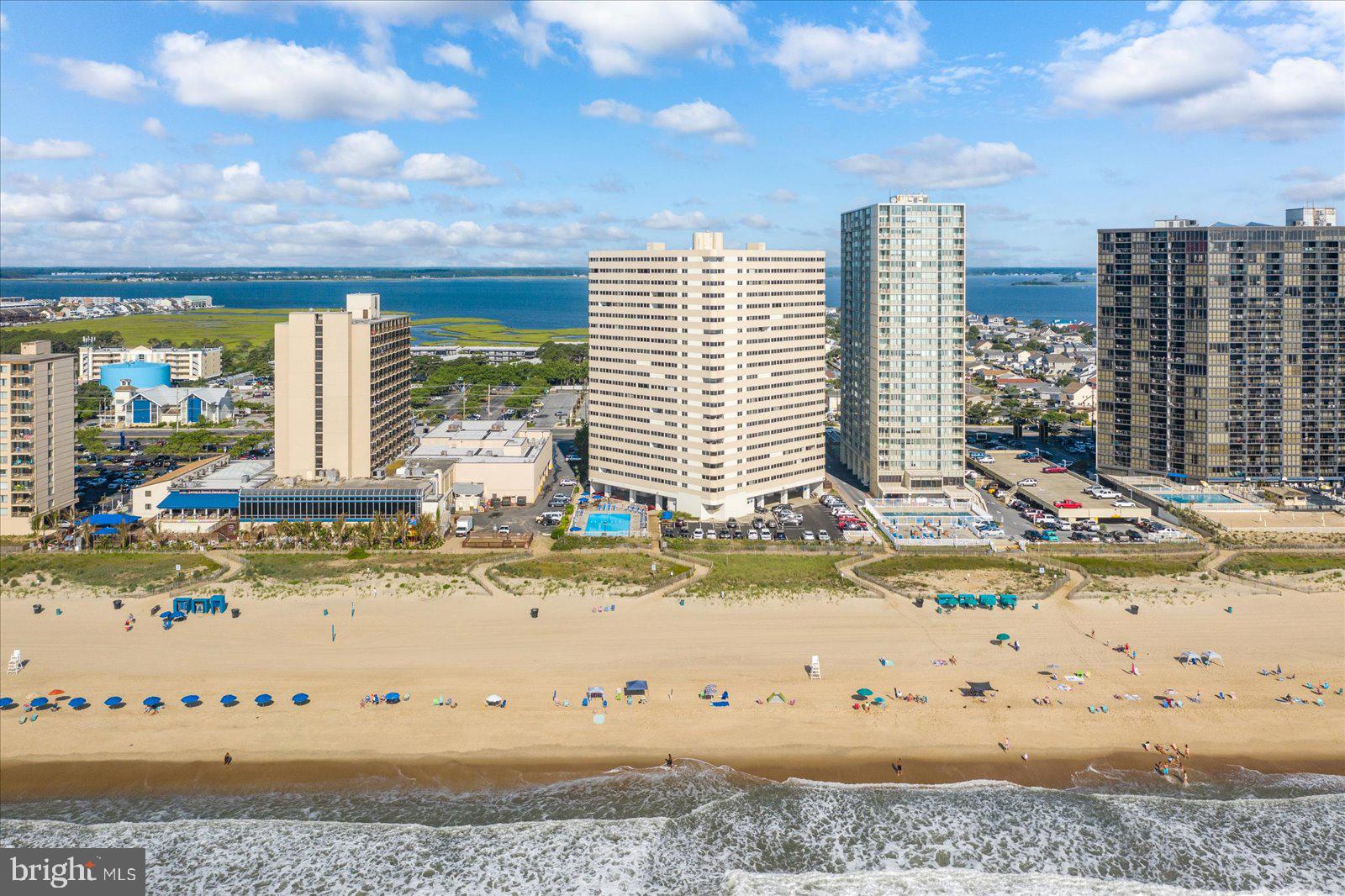 With a stunning oceanfront location this 2-bedroom 2-bathroom condo has been completely remodeled!  Upon entering you will notice the floors are luxury vinyl plank and feature matching baseboard trim for easy cleaning and maintenance.  You will be impressed with the kitchen which has gray shaker style cabinets, granite countertops, and stainless-steel appliances.  The soothing paint colors throughout and abundance of recessed lighting will be appreciated.  Each bathroom has been remodeled with custom tiled showers, new vanities, and lighting.  All interior doors have been replaced and closets upgraded with custom shelves.  This condo delivers fully furnished and ready for Summer 2026!  The Atlantis complex features an outdoor pool, secure lobby, and on-site professional building management.