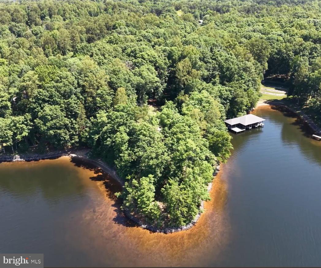 Over 800 Feet of waterfront with the widest views at Lake Anna! 4 bedroom drainfield installed, well installed, 3 stall boathouse, beach and waterfront rip rapped.
NO HOA but you can join the recreational use association  for use the ramp.
Original house burned down so please be careful during showings. 
PLEASE WATCH VIDEO