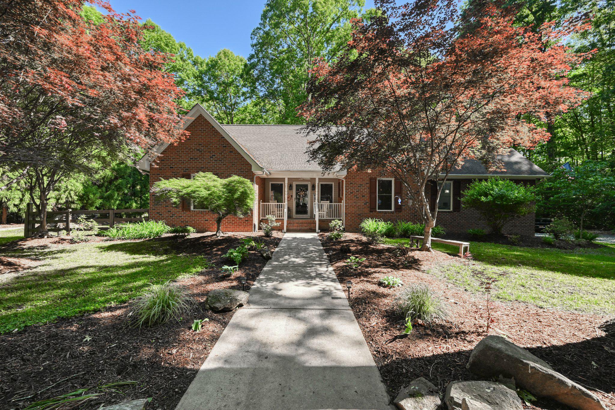 This lake access home is located on the public side of Lake Anna and offers the perfect blend of comfort, privacy, and lake lifestyle living.

The current owners completed several standout upgrades they never expected to leave behind. The fully remodeled primary bathroom feels like a private spa retreat, featuring a soaking tub, walk-in tiled shower, dual sink vanity, updated lighting and mirrors, and gorgeous tile flooring.

The kitchen has also been refreshed with quartz countertops, updated appliances, and new LVT flooring, creating a bright and modern gathering space at the heart of the home.

Designed for easy main-level living, the open floor plan offers both connection and privacy. The spacious primary bedroom is tucked away on one side of the home, while the additional bedrooms are situated on the opposite side. Upstairs, a beautifully updated bonus room and full bathroom provide the ideal guest suite, recreation room, or private retreat.

Situated on a stunning level 3.12-acre lot, the property is surrounded by mature trees and thoughtfully curated landscaping. Enjoy Japanese maples, fig trees, elderberry trees, and raised garden beds ready for your next harvest.

The backyard is made for entertaining, complete with a fenced yard, expansive wood deck, and a brand-new fire pit area — perfect for relaxing evenings with family and friends.

Located in the sought-after Sycamore Shoals community, a private 40-lot subdivision on the public side of the lake, residents enjoy a peaceful setting just minutes from Lake Anna Winery, The Log Cabin, The Taphouse, Lake Anna State Park, marinas, the local grocery store, restaurants and more. Community amenities include a private gated common area with picnic space, sandy beach, mooring area, tender pier, gravel parking lot, boat launch, and a recently renovated covered boathouse with sundeck. Recent renovations include new PVC decking and new boat house roofing and gutters. 

Best of all, this property conveys with Boat Slip #13, offering deep water, easy access, and an electric boat lift. The community boathouse is also located in a no-wake zone for added convenience and protection.

There is a special assessment in addition to the POA dues. The 2026 reserve assessment is $1,683 and supports the boathouse reserve and capital reserve funds. Once fully funded, the assessment is expected to decrease significantly.