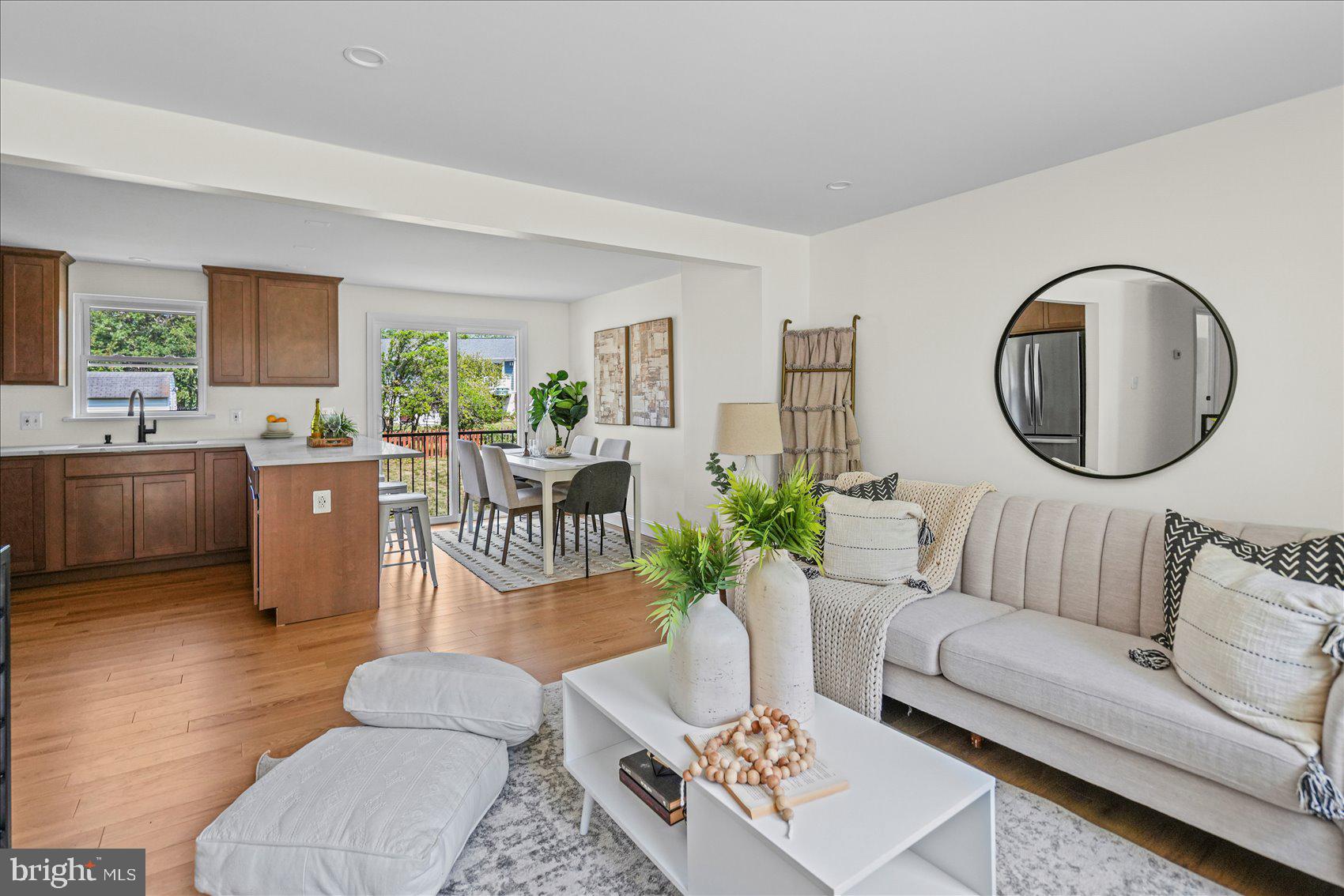 Welcome home to this beautifully renovated split-foyer residence! As you enter, you'll be greeted by abundant natural light, luxury vinyl plank flooring, recessed lighting, and an open-concept layout that's perfect for everyday living and entertaining.

The spacious living and dining areas flow seamlessly into the stylish kitchen, featuring stainless steel appliances, quartz countertops, a breakfast bar, and ample cabinet space.

The main level offers three generously sized bedrooms, including a primary suite with a private en-suite bathroom. Luxury vinyl plank flooring extends throughout the entire main level, adding both style and durability.

The finished lower level boasts a large family room, a full bathroom, and the potential to create two additional bedrooms, making it ideal for guests, a home office, or extended living space.

Step outside to enjoy the large, flat, fully fenced backyard—perfect for entertaining, pets, or play. The oversized driveway provides off-street parking for at least two vehicles.

This move-in-ready home combines modern finishes, flexible living space, and a fantastic outdoor setting. Don't miss the opportunity to make it yours!