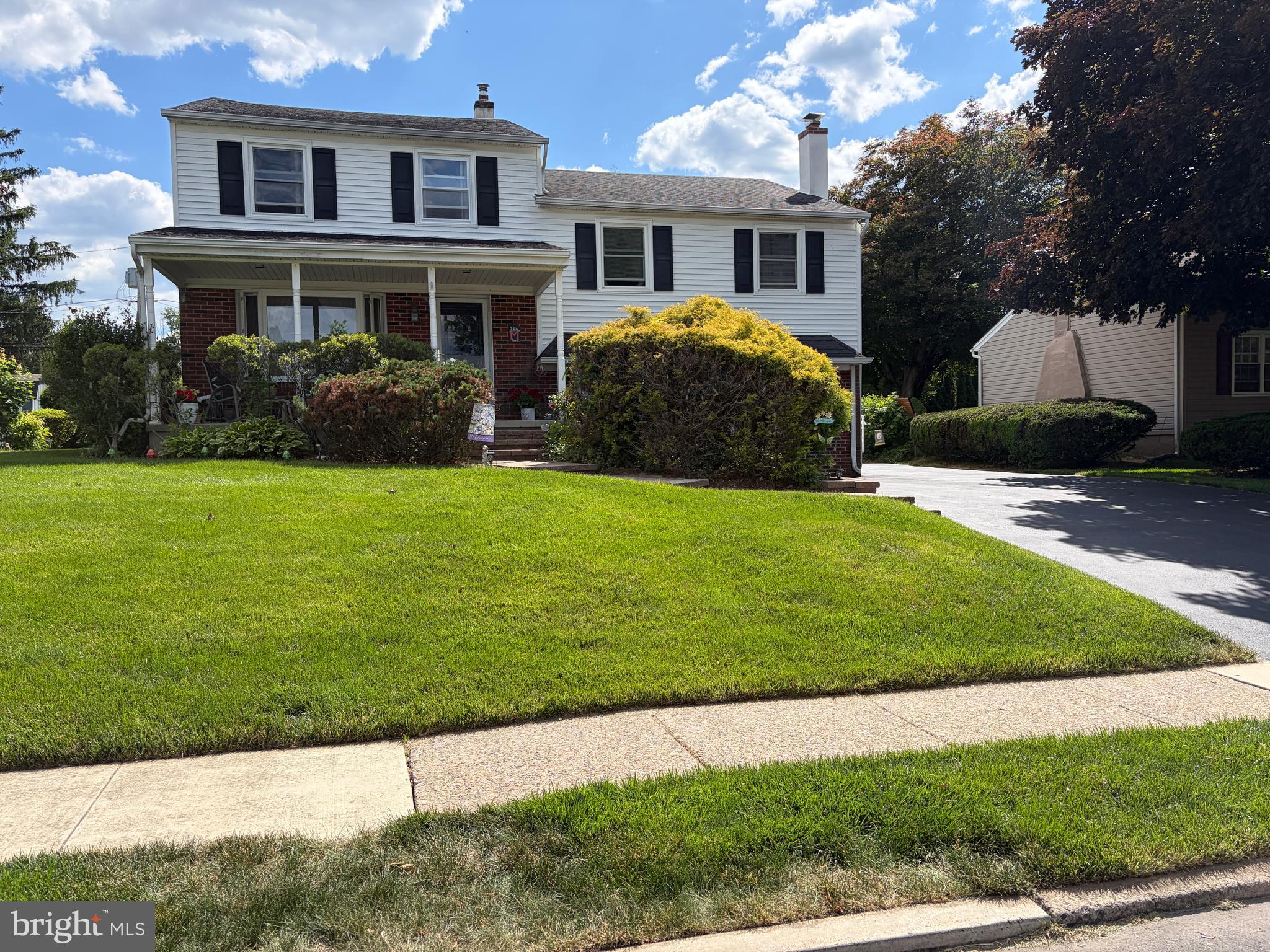 Welcome to this well-maintained 4-bedroom, 2.5-bath split level home offering approximately 2,400 square feet of living space in desirable Upper Dublin Township and its highly regarded school district. Set on a beautifully maintained 0.27-acre lot in a quiet neighborhood close to the elementary school and neighborhood swim club, this home offers space, comfort, and convenience in a peaceful setting.
A welcoming covered front porch leads into a bright and generously sized living room featuring hardwood floors, a gas fireplace, a bow window, and abundant natural light. The modern eat-in kitchen offers granite countertops, a center island, two sinks, extensive cabinetry, and sliding glass doors leading to the patio and large backyard, ideal for entertaining, outdoor dining, and family gatherings.
Just a few steps down from the living room is the large family room, providing additional living and entertaining space complete with a second gas fireplace and a lovely bar area. The spacious mudroom/laundry room includes outdoor access to the driveway along with a convenient powder room.
Upstairs, the very spacious primary suite features raised ceilings, hardwood flooring, a sitting area, multiple closets including separate his-and-her closets plus an additional closet, abundant windows for natural light, and a full private bath. Three additional bedrooms are all generously sized and share a full hall bathroom.
Additional highlights include vinyl siding, replacement windows, a tankless Navien hot water system, attic storage, a storage shed, and ample driveway parking.
Conveniently located near parks and walking trails, shopping and dining, and major roadways including the Pennsylvania Turnpike, this home offers an excellent opportunity in an established Upper Dublin neighborhood.