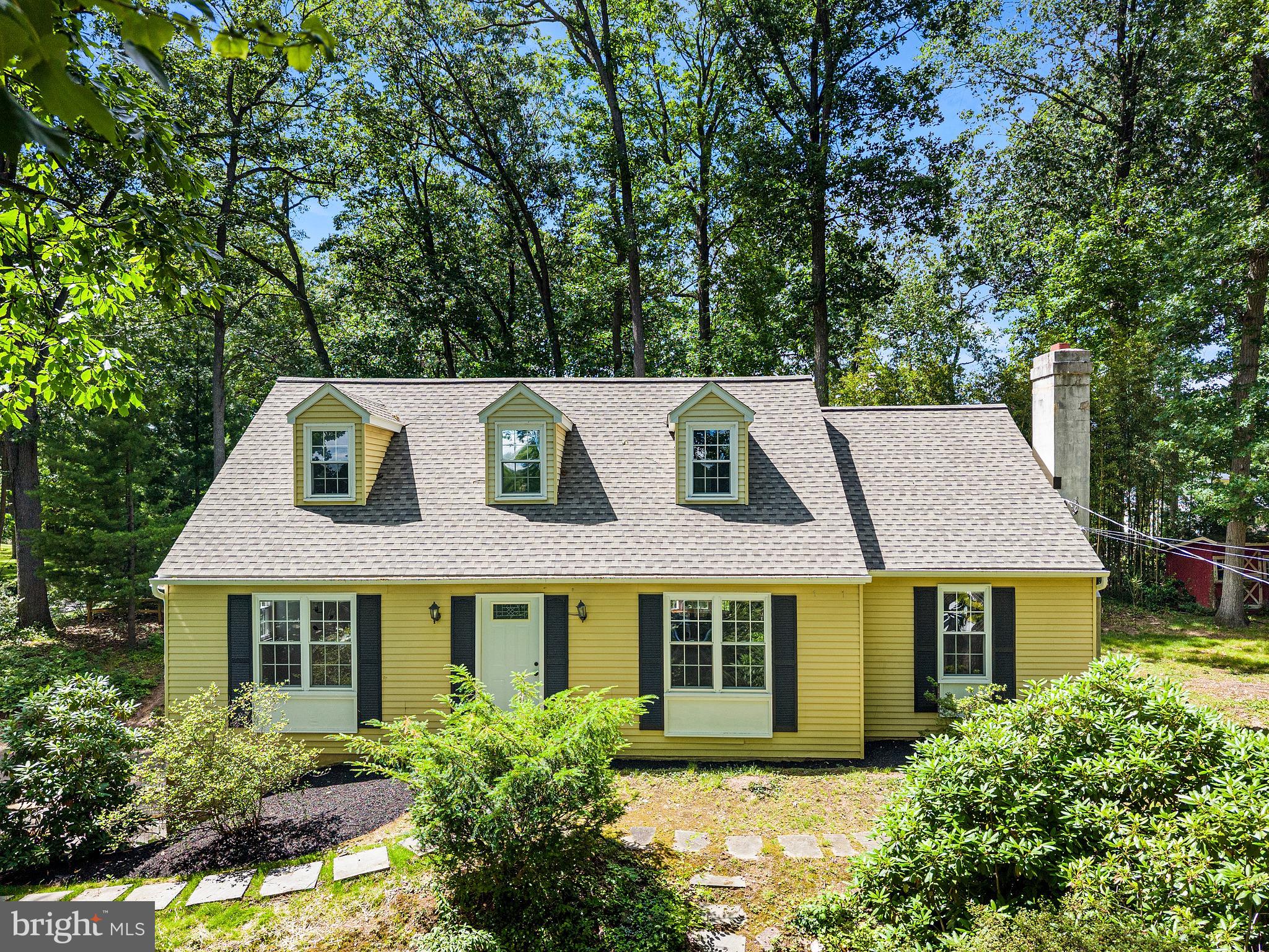 Welcome to 1199 Glenside Road, a charming and spacious Cape Cod situated on a beautifully wooded corner lot in the desirable Summit Ridge neighborhood. Step inside the foyer and into the inviting living room, which flows seamlessly into the cozy family room area featuring hardwood floors, and a brick, wood-burning fireplace—the perfect gathering place for holidays and special occasions.

The sun-filled dining room showcases a large bay window, creating a warm and inviting space for entertaining. Just beyond, the expansive eat-in kitchen offers newer stainless steel appliances, generous counter space, abundant cabinetry, and easy access to the backyard.

Step outside to enjoy the private outdoor retreat, complete with a deck and stone paver patio surrounded by mature trees and lush landscaping, and a brand new fence (2026). Whether you're hosting guests or enjoying a quiet evening, this peaceful setting is sure to impress.

Convenient one-floor living is possible with a first-floor primary bedroom, a full renovated (2026) bathroom with a tub/shower combination, and a second bedroom that could also serve as a home office or guest room. Upstairs, you'll find two additional spacious bedrooms, each with access to updated bathrooms (2021).

The unfinished basement provides laundry facilities, access to the attached two-car garage, and a large workshop area offering endless possibilities for hobbies, storage, or future expansion.

Additional updates include a brand-new roof (2026), as well as new furnace, hot water heater, newer electrical panel, flooring, all in2021. Ideally located within the Downingtown Area School District and just minutes from shopping, dining, parks, and major commuter routes, this home offers the perfect combination of comfort, space, and convenience.