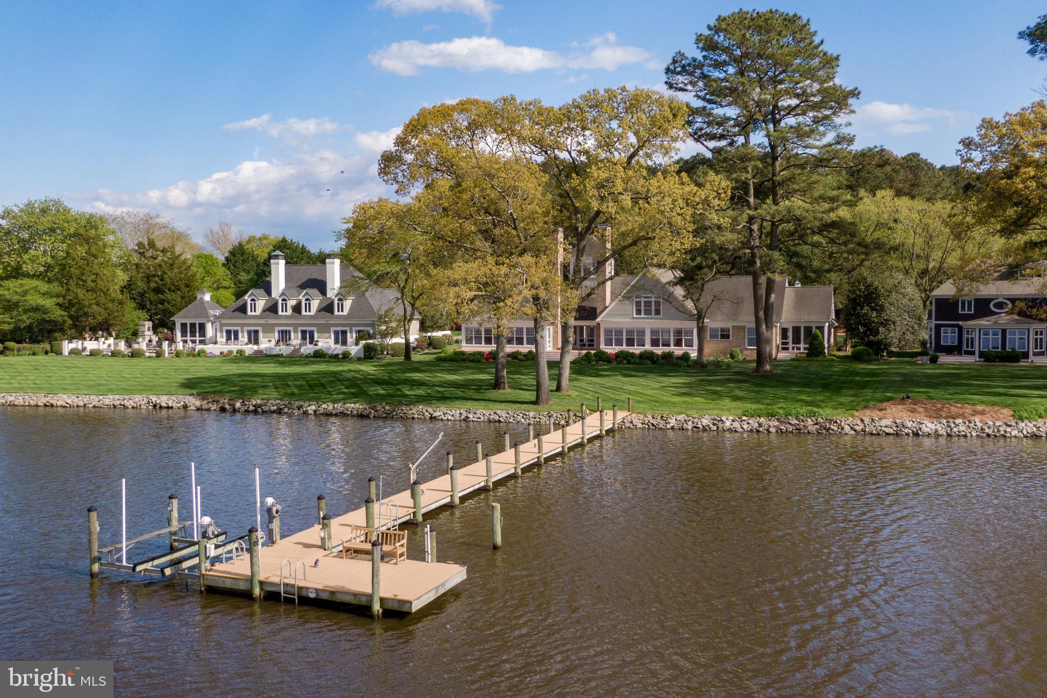See VIDEO TOUR LINK! Stunning Riverfront home in the secluded James Landing subdivision on the Wicomico River.  Amazing opportunity to purchase this home that has never been available to the market until now.  One of the best riverfront locations in Salisbury you could ever ask for! Impeccable grounds, flowering shrubs, shade trees, plush lawns, incredible pier with boat lift, kayak/canoe lift, benches, blacktop driveway with roundabout, 3 Car garage w/ walk up 2nd floor, spiral staircase to the 3rd floor look-out tower with sunny seating benches, 3 BR, 5 BA (1st floor Primary bedroom with his and hers bathrooms), space for 2-3 more bedrooms upstairs in the unfinished space, built in generator, lawn and garden irrigation, and large composite deck. Enter this coastal style home to the spacious foyer which opens directly to the deck & wide open river. Enjoy the tall ceilings and open floorplan in the huge great room central to the home with incredible views of the serene backyard and waterfront.  Large Kitchen features granite countertops, new tile backsplash, new cooktop, new stainless double wall ovens and microwave, stainless dishwasher, custom panel Sub Zero refrigerator/freezer, lots of storage, and a pantry.  A full bathroom, and spacious laundry room with sink are located near the kitchen. You'll spend many hours on the tranquil screened porch just off the kitchen, comfortably soaking up the breathtaking scenery just outside! A lovely craft room, sitting room or office is located in the front of the great room and features built-in storage, a bay window with seating, and views of the park like setting in the front yard. Coat closet and utility room for mechanical items and a water treatment system are conveniently near the front. The east end of the home features   Just past the office you enter the large first floor primary bedroom with riverfront views, 2 full bathrooms, and 2 huge walk in closets. Primary bathroom 1 is beautifully updated with a well appointed steam shower, and lovely tile work.  Primary bathroom 2 features a walk in jetted tub for soothing and relaxing after a long day.  Upstairs, you find the 2nd bedroom with gorgeous views of the river, vaulted ceilings and an en-suite full bathroom. The 3rd bedroom also has vaulted ceilings and views of the colorful front yard. A full guest bathroom and several storage closets are located off the hallway. The large unfinished space on the 2nd floor would be perfect to finish 2 large bedrooms and a den or sitting area which would convert the home to a 5 BR / 5 BA floor plan. an incredible waterfront office with built in bookcases, a gas fireplace, and a mini-bar area. This property is truly a dream come true for anyone looking to live on the river.  The rear deck and plush yard are irresistible and the views just cannot be compared!  Gazing across the river you only see natural marshes and trees, bald eagles, herons and egrets diving for fish, their nests atop tall trees, and views of the Pemberton Historical Park. The onsite pier and boat lift will have you hopping on the river in minutes, living the life you always dreamed of right here in James Landing just 2.5 miles to Salisbury University and downtown Salisbury locations! James Landing is a small secluded subdivision of 6 homes buffered from Riverside drive by a large wooded area through which James Landing, the private road runs.Appraiser sketch shows: 4442 sqft finished, 1300 sqft 2nd floor unfinished, 1675 sqft 3 car garage has 2nd floor, 1230 sqft deck. HVAC-1st floor-2 propane furnaces, 2 central air units, 2nd floor heat pump, great room fireplace - wood burning, office fireplace - gas, Mastic Quest premium vinyl siding 2019 replaced old cedar siding, roof replaced 2007!  This is an Estate home and will be sold AS-IS.