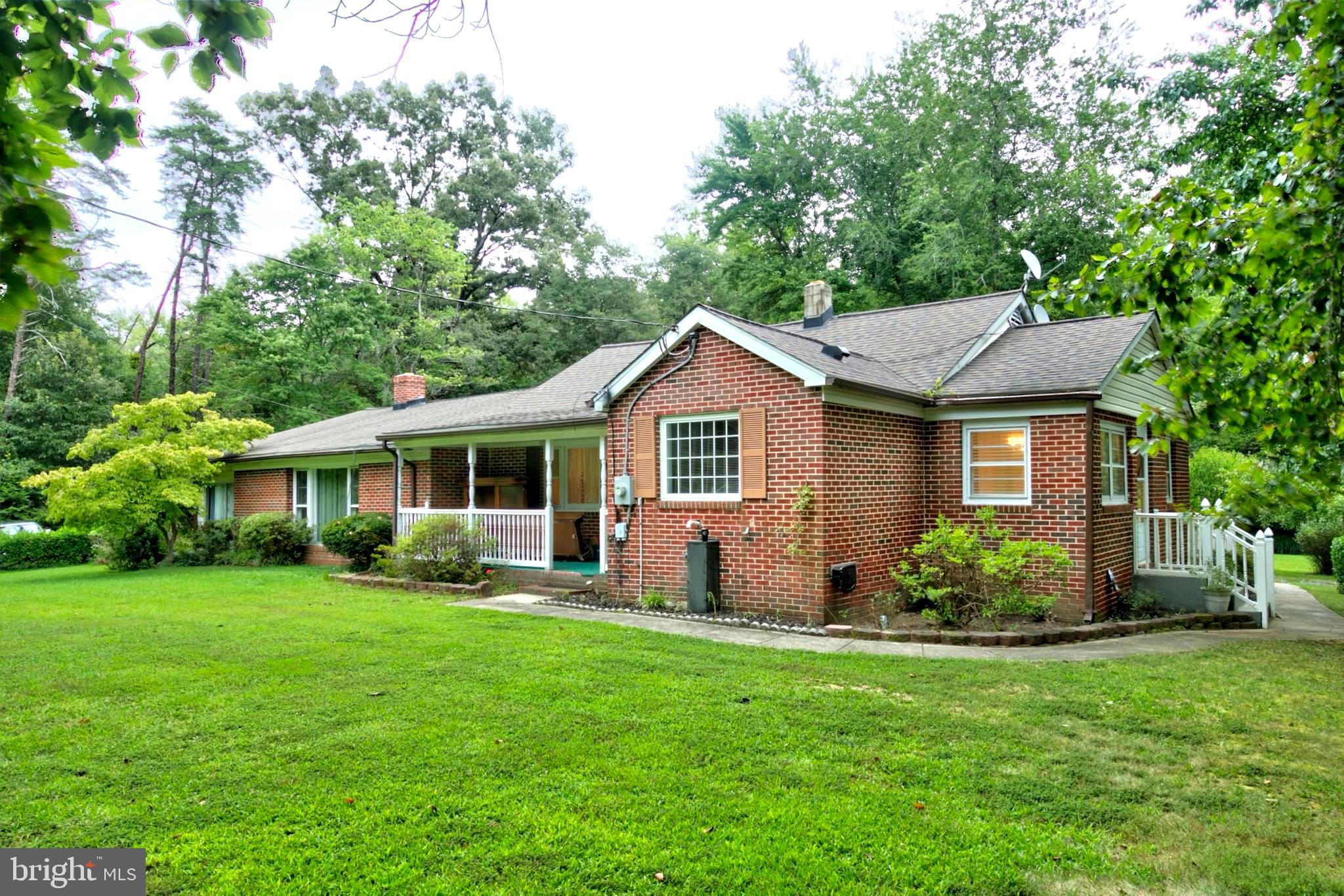 PRICE IMPROVEMENT!  This home was initially listed at appraised value of $448,000.  Estate Property - Sold As Is – Move-In Ready! This almost entirely brick 3-bedroom, 2-bath rambler offers spacious single-level living in a serene rural setting. The large kitchen has been partially updated and features a large granite island that opens to a cozy family room—perfect for hosting friends or enjoying quiet evenings.  The adjacent formal dining and oversized living room provide ample space to entertain. Off the living area, the 2-sided glass-enclosed patio with a wood-burning stove adds year-round comfort and charm. The main bedroom includes an en suite bath and large walk-in closet. Hardwood floors are exposed in some areas and also exist beneath carpeted areas throughout.  Enjoy morning sunrises from the east-facing deck and sunsets from the covered front porch. The circular driveway provides plenty of parking. A large storage shed adds value.  The roof was replaced in 2017.  A few minute’s drive to fishing, boating, and hiking. Located less than 5 minutes from Nanjemoy Country Store and  local Community Center. Conveniently located just 20 minutes to La Plata and 30 minutes to Waldorf.  Agent is related to seller.