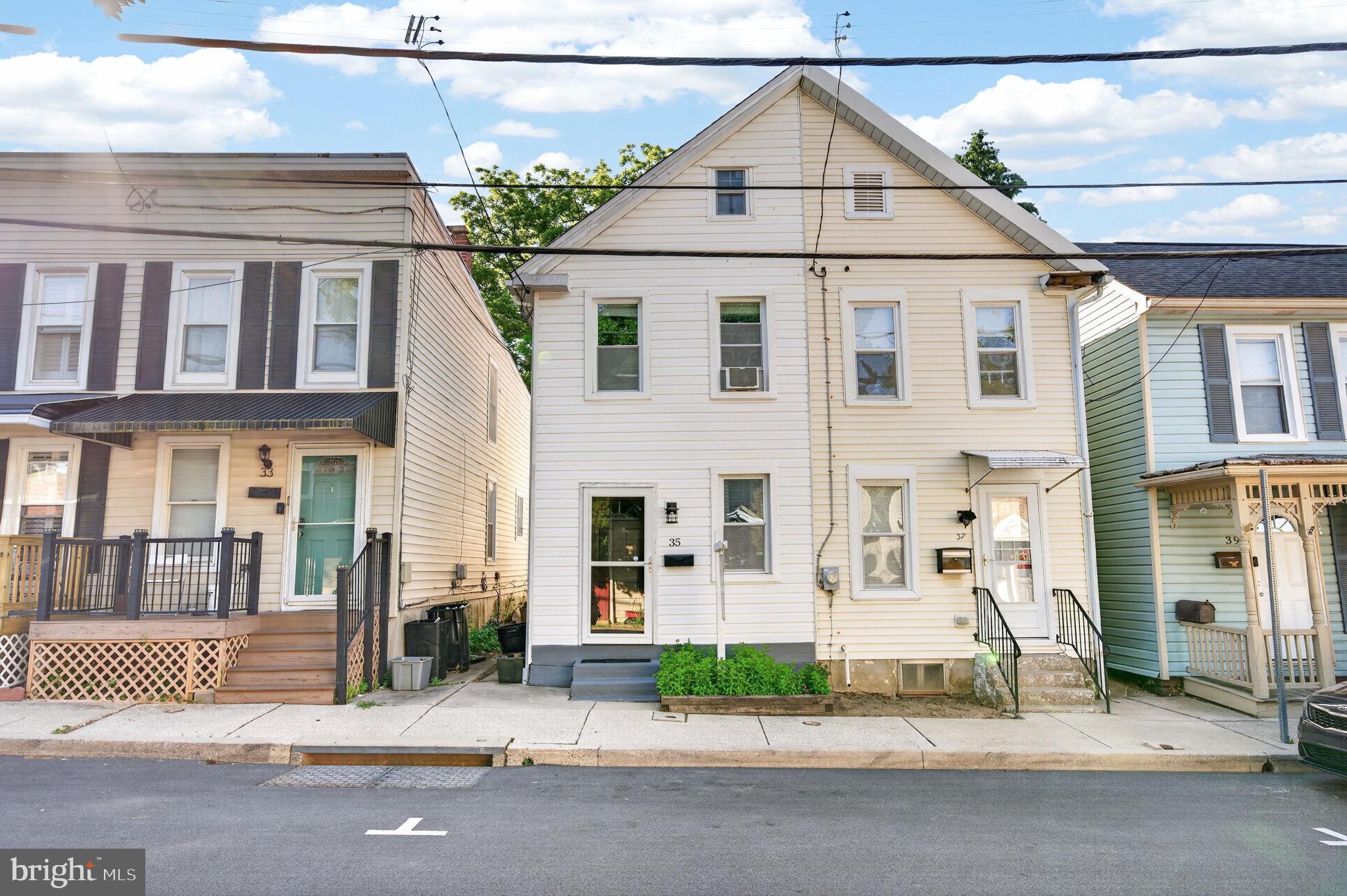 Beautifully maintained and move-in ready 2BR/1BA semi-detached Colonial located on a quiet street in downtown Westminster.  If you're looking for a low maintenance home with easy walkability to restaurants, shopping, and recreation of downtown Westminster OR something that is highly rentable to build your investment portfolio, this place is for you! Accented with lots of natural light, handsome original hardwood floors, crown molding, and an open concept floor plan.  The main floor features a living room open to the kitchen.  The kitchen features abundant cabinets and countertops. Just beyond the kitchen are the main floor laundry and a full bath.  On the second floor are two bedrooms, one with access to the third floor, which offers an open loft/flex space that could be used for additional living space, home workspace, or as a 3rd bedroom.  Private fenced rear yard offering a large patio, hardscaping, and a sprawling lush green lawn ideal for hosting family and friends.  House backs to McDaniel College. New water heater (2024), carpet (2024), and paint (2024), this move-in-ready home is ideal for any new homeowner and is located close to shopping, restaurants, downtown Westminster festivals, and commuter routes.