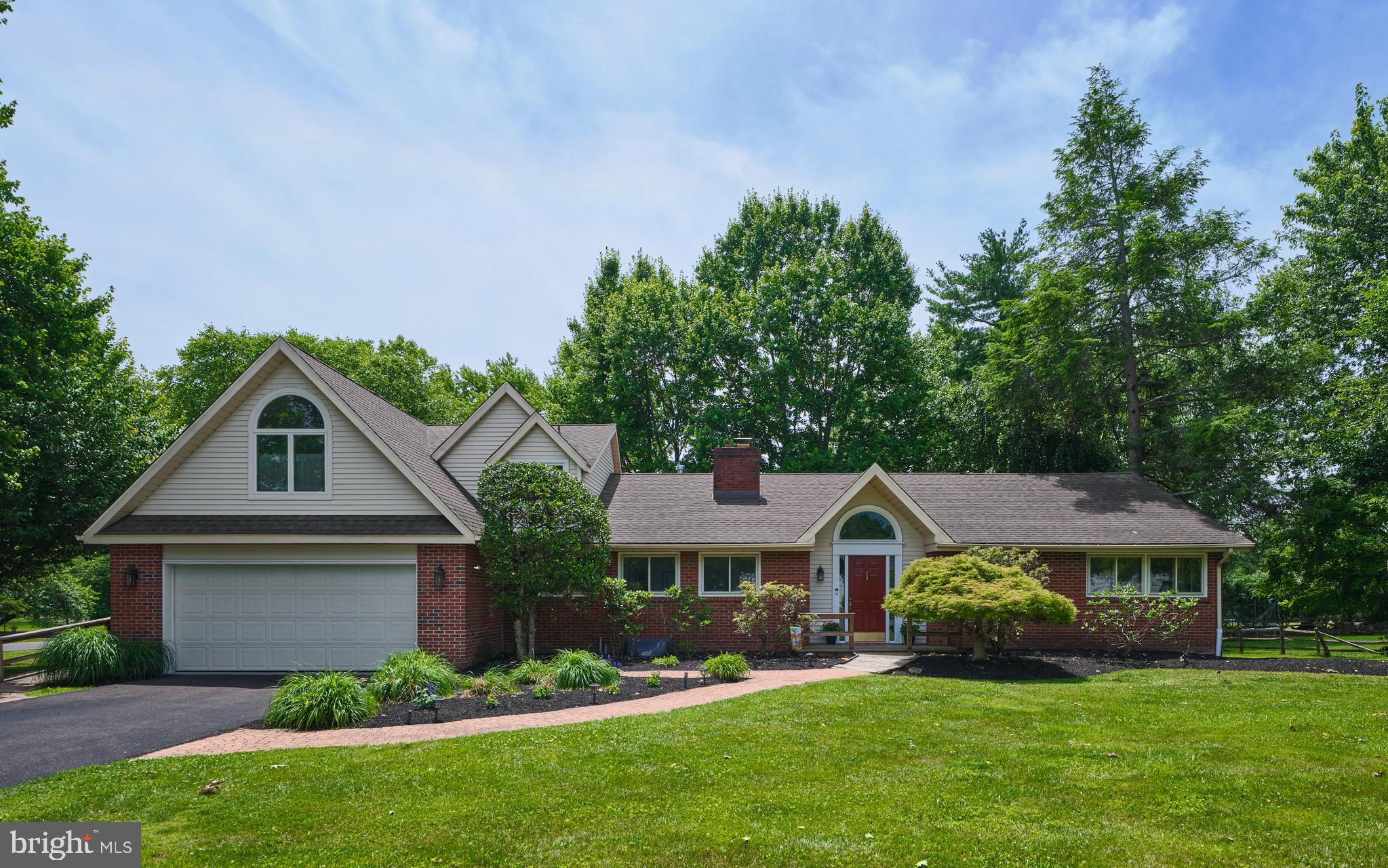 Situated on a corner lot in peaceful Mardot Village, this well loved ranch conversion awaits a new owner.  Originally constructed as a ranch home, a later addition in the mid 90s  added an upper level bedroom and bath (a second primary suite).  The first floor expansion included  the stairs to the upper level with a balcony overlook, a laundry area with an outside entrance, a dining area with triple window with a palladian style top, vaulted ceiling, and views of the lovely yard.  The kitchen features abundant cabinetry, an island with wheelchair accessible cooktop and microwave, a secondary built-in microwave.  The floorplan is very open with living, dining, family room and kitchen creating a functional and appealing flow. The spacious sunroom overlooks the rear yard and features Pella windows and a tile floor.  A previous leak precipitated the removal of the sheet rock and the new owner can redesign this room to suite their tastes and needs   The living and dining rooms as well as the hallways and 3 first floor bedrooms all have oak flooring.  Bedrooms 2 and 3 share a hall full bath in a charming 50s inspired green and white tile.  The former primary bedroom is adjacent to a large primary bath with a soothing gray and white tile palette, jetted tub, and stall shower.  This bath has views of the rear yard and the windows were recently replaced in 2025. A mud room and a study with built in bookshelves and a small office, complete the main level.  
The basement features new carpet and paint in the finished recreation room.  A small office is tucked inton a corner and there is also a large unfinished area of the basement - perfect for workshop, workouts and storage. There is a door to the rear yard from the unfinished part of the hasement.  In addition, the house has a large deck in fair condition, a two car garage, and a shed - perfect for lawn equipment and landscape needs.  
Enjoy Council Rock Schools and its excellent reputation, shopping in nearyby Newtown Borough and the Township, abundant restaurants such as LaStalla, Melange, Meglios and several up and coming dining spots.  A commuters dream with easy access to Septa trains, 95, 295 and the PA Turnpike for those working in the Philadelphia, Trenton, Princeton and NYC areas.