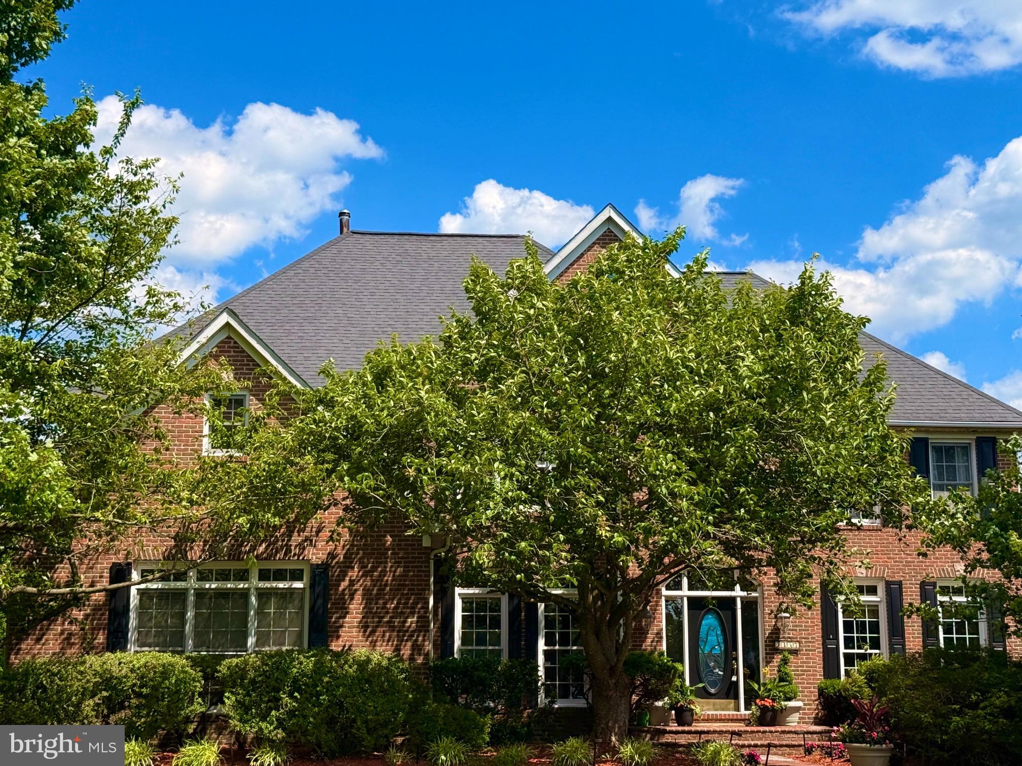 PRICE IMPROVED! 
Step into refined elegance with a grand 2 story foyer showcasing intricate, ornate crown molding, that immediately sets a sophisticated tone. Designed with both style and function in mind, this magnificent four bedroom, four full and one half bath luxury home, in sought after Glenwood, in Howard County, offers beautifully appointed living spaces enhanced by timeless architectural details throughout. Located to the right of the soaring 2 story entrance foyer, is the freshly painted formal living room with crown molding.
The formal dining room is a standout, featuring classic crown molding, chair rail accents, and an eye-catching ceiling medallion—perfect for hosting gatherings both intimate and grand, with a lush green vista view of the rear grand yard. A versatile office or library provides the ideal space for working from home, reading, or creating a quiet retreat. The main level laundry room has been completely remodeled and updated with brand new flooring and utility sink and  fresh paint.
At the heart of the home, the living areas flow seamlessly into the eat-in kitchen with stainless steel appliances, a double oven, and a brand new cooktop with downdraft  just installed in the large island, offering comfort and flexibility for everyday living. The screened-in covered deck extends your living space outdoors, creating a serene setting for morning coffee, evening relaxation, or entertaining guests in a peaceful environment.
The primary suite serves as a private sanctuary, complete with a tray recessed ceiling, rich hardwood flooring, and a spa-inspired en-suite bath. Enjoy the luxury of a soaking tub, a wide walk-in shower, his and her vanities, a colossal size walk in closet and a thoughtfully designed layout that promotes both comfort and relaxation.
Three additional bedrooms are generously sized, all featuring walk-in closets and plush carpeting or hardwood flooring, ensuring comfort for family and guests alike, including a guest suite with attached full bathroom. The two additional second level bathrooms with updated vanities and quartz countertops, marble flooring and well-appointed fixtures add both style and functionality.
The finished basement significantly expands the home’s living space and versatility. It includes a large recreation room ideal for entertaining or home theatre, a game area with built-in bar, picture frame molding accent wall, durable LVP flooring and convenient walkout access, and a full bathroom. Multiple additional rooms offer endless possibilities, whether you envision a home gym, media room, playroom, or secondary office space. A large finished bonus room featuring 2 cedar closets can transform into multiple living options for new buyers. The lower space can easily functionalize as a multi-generational, au-pair or in-law suite.
Outdoor living continues on the lower-level stamped concrete patio, providing a perfect setting for gatherings or quiet evenings. A hot tub off the back patio has been recently sealed, offering an added element of relaxation and enjoyment while looking out onto the expansive fairway like acreage in the back yard.
Additional highlights include a main-level powder room for guests, a dedicated main level laundry room equipped with a front-loading washer, dryer and utility sink. and a spacious utility room in the basement providing ample storage and functionality.
Blending classic design elements with modern conveniences, this home offers exceptional space, versatility, and comfort—perfectly suited for today’s lifestyle.