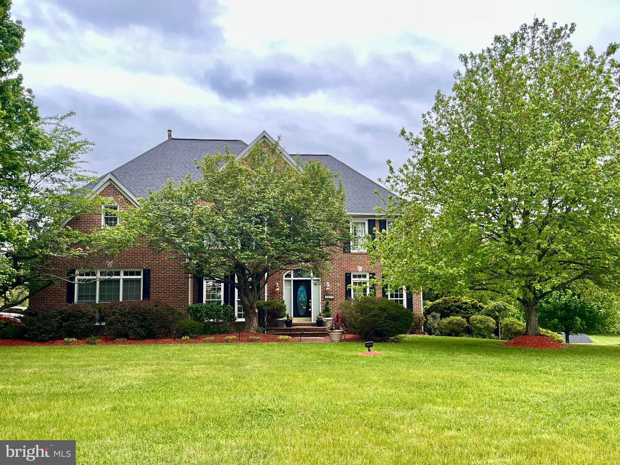Step into refined elegance with a grand 2 story foyer showcasing intricate, ornate crown molding, that immediately sets a sophisticated tone. Designed with both style and function in mind, this magnificent four bedroom, four full and one half bath luxury home, in sought after Glenwood, in Howard County, offers beautifully appointed living spaces enhanced by timeless architectural details throughout. Located to the right of the soaring 2 story entrance foyer, is the formal living room with crown molding.
The formal dining room is a standout, featuring classic crown molding, chair rail accents, and an eye-catching ceiling medallion—perfect for hosting gatherings both intimate and grand, with a lush green vista view of the rear grand yard. A versatile office or library provides the ideal space for working from home, reading, or creating a quiet retreat.
At the heart of the home, the living areas flow seamlessly into the eat-in kitchen with stainless steel appliances, a double oven, and a brand new cooktop just installed in the large island, offering comfort and flexibility for everyday living. The screened-in covered deck extends your living space outdoors, creating a serene setting for morning coffee, evening relaxation, or entertaining guests in a peaceful environment.
The primary suite serves as a private sanctuary, complete with a tray recessed ceiling, rich hardwood flooring, and a spa-inspired en-suite bath. Enjoy the luxury of a soaking tub, a wide walk-in shower, his and her vanities, a colossal size walk in closet and a thoughtfully designed layout that promotes both comfort and relaxation.
Additional bedrooms are generously sized, all featuring walk-in closets and plush carpeting or hardwood flooring, ensuring comfort for family and guests alike. Bathrooms throughout the home are finished with quality materials, including quartz countertops, marble flooring, and well-appointed fixtures that add both style and functionality.
The finished basement significantly expands the home’s living space and versatility. It includes a large recreation room ideal for entertaining or home theatre, a game area with built-in bar, picture frame molding accent wall, durable LVP flooring and convenient walkout access, and a full bathroom. Multiple additional rooms offer endless possibilities, whether you envision a home gym, media room, playroom, or secondary office space. A large finished bonus room featuring 2 cedar closets can transform into multiple living options for new buyers. The lower space can easily functionalize as a multi-generational, au-pair or in-law suite.
Outdoor living continues on the lower-level stamped concrete patio, providing a perfect setting for gatherings or quiet evenings. A hot tub off the back patio has been recently sealed, offering an added element of relaxation and enjoyment while looking out onto the expansive fairway like acreage in the back yard.
Additional highlights include a main-level powder room for guests, a dedicated main level laundry room equipped with a front-loading washer, dryer and utility sink. and a spacious utility room in the basement providing ample storage and functionality.
Blending classic design elements with modern conveniences, this home offers exceptional space, versatility, and comfort—perfectly suited for today’s lifestyle.