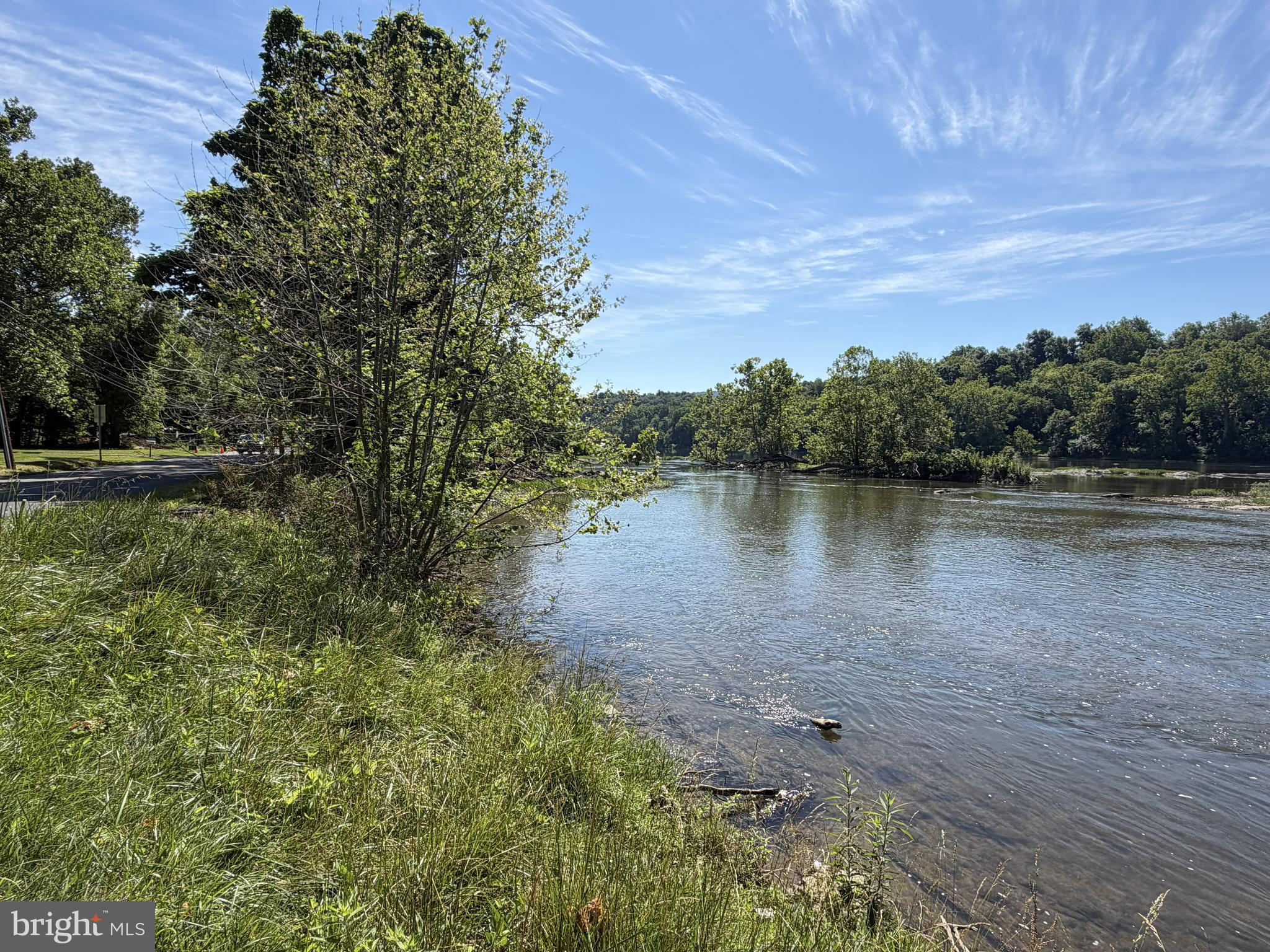 AERIAL PHOTOS coming July 1. ...Act fast for this UNRESTRICTED, CLEARED residential lot on the SHENANDOAH RIVER! The seller has septic, well, and driveway PERMITS in hand, and now his change of plans could be your chance to live the riverfront dream! The half-acre lot has 46 feet of waterfront for your kayaking, fishing, and nature-watching enjoyment. Take an easy float downriver to public boat launches and picnic areas at Moulton Park and Big Eddy. If new home construction is your goal, higher ground at the back of the lot provides a potential site above the flood plain, and the approved perc supports a 2BR septic design. Or, simply park your camper or set up your tent and start your vacation lifestyle today! Charles Town center is 2 miles away with trendy restaurants, charming shops, Hollywood Casino and horse racing. Nearby attractions are the Appalachian Trail, historic sites from George Washington’s heritage and the Civil War, and craft breweries and vineyards. All this, plus easy access to northern VA and DC.