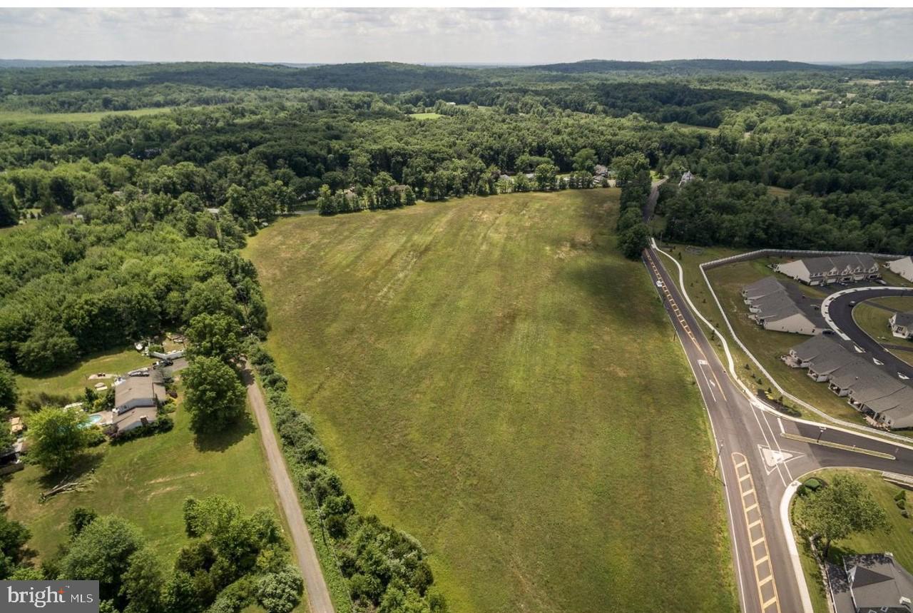 This 15-acres of land in rural Richland Township is flat and open, with mature tree-lined boundaries offering privacy on two sides.  With 2,270 feet of frontage on W. Paletown and Smoketown Roads it is ideally located  across from Ryan Homes at Arbours at Morgan Creek. It is also 10 minutes from Quakertown shopping and dining.  It is also conveniently located near Nockamixon State Park, and 20 minutes from the  Pennsylvania Turnpike Northeast Extension 476.  This parcel is located in the RA Zoning District. Chapter 27 of the Zoning Ordinance under 27-404 lists the uses that are permitted in the RA Zoning District, and 27-405 further defines each specific use. There is no availability to connect to public water and sewer as this parcel is located outside of the Act537 Plan. The seller has added a driveway and a well.  Previous information from a 2005 septic site evaluation proposed four-year fill sites and 5-6 residential lots possible. This beautiful and scenic parcel of land is an excellent investment opportunity for your development project.  Don't miss out on this one!
