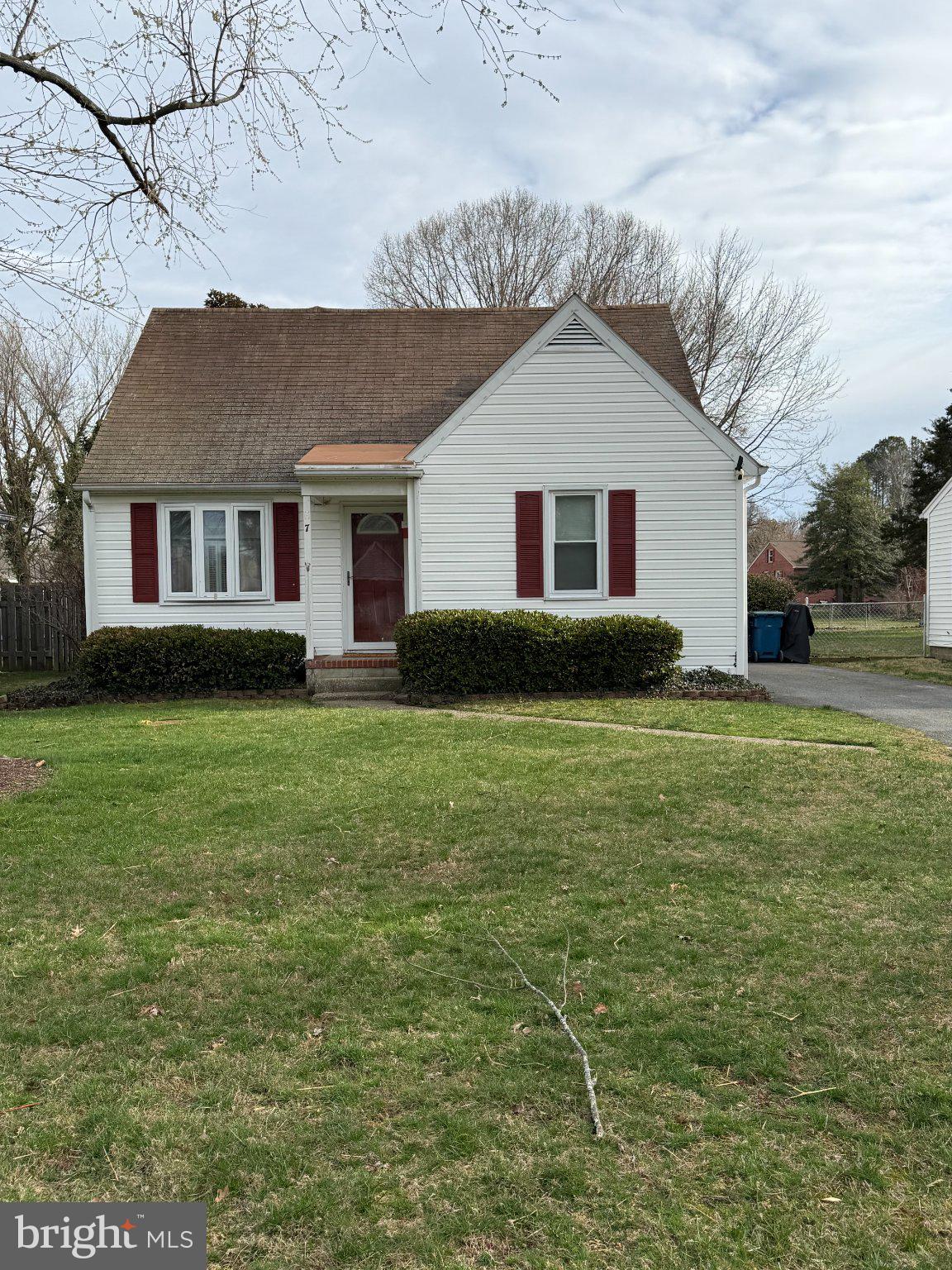 Conveniently located between Route 50 and historic downtown Easton, this charming 1950s cottage is being sold as and presents a fantastic opportunity for homeowners and investors alike. Set back from the street with a large, private backyard, the home offers timeless character and original details throughout. 
The first floor features a welcoming living room with hardwood floors and arched doorways, adding warmth and classic appeal. A nicely sized kitchen opens to the dining room, where sliding glass doors lead to the porch for easy indoor-outdoor living. Two spacious bedrooms and a full bath complete the main level.

Upstairs, the second floor offers a generous primary bedroom with a full bath, creating a private retreat.

This property is also an investor’s dream, having served as a profitable rental for many years with the potential to continue as such. With its flexible layout, it may also offer the possibility of conversion into a two-family property, with the second-floor functioning as a studio and the first floor as a two-bedroom unit.
Owner will offer settlement assistance.