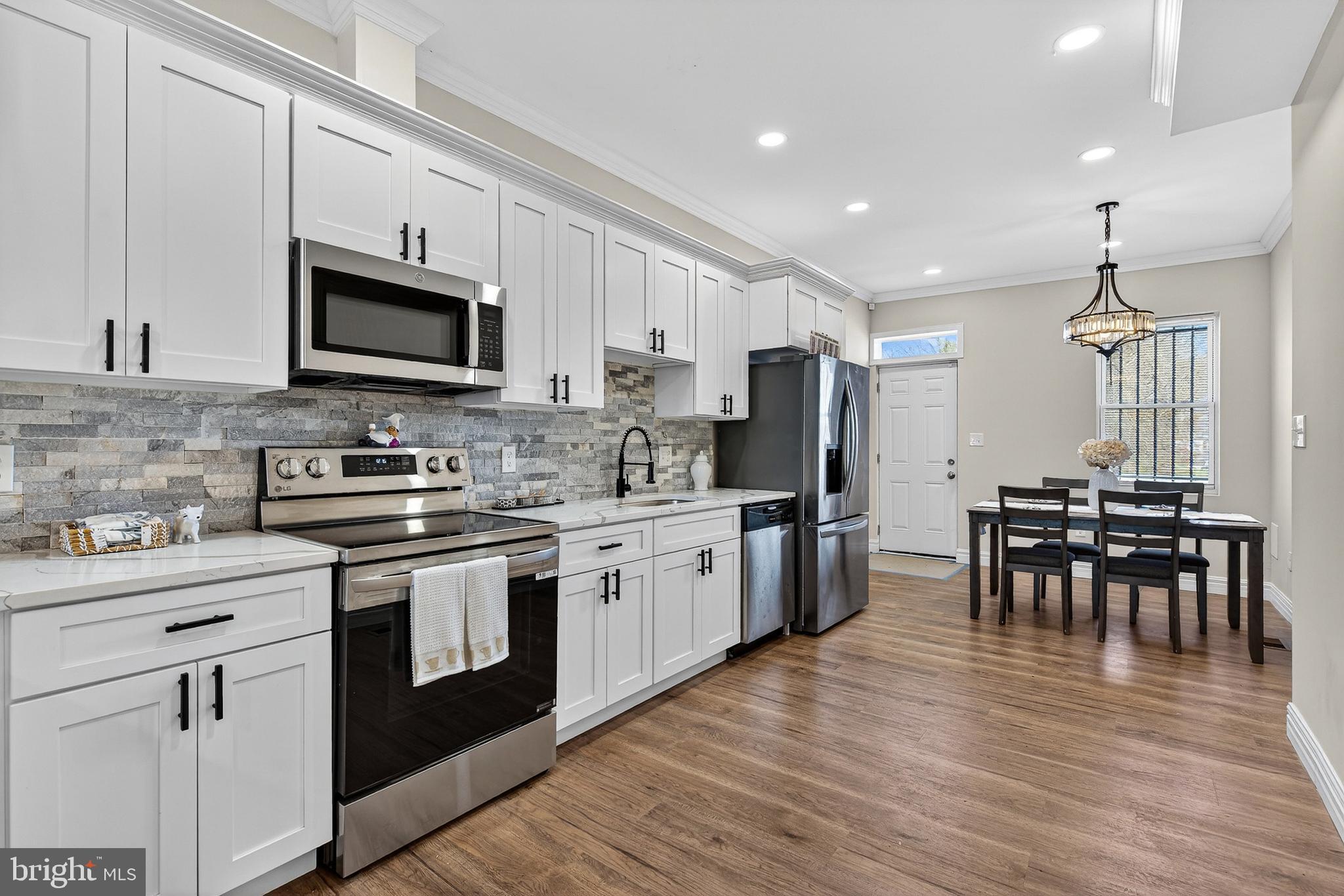 AGENTS - PLEASE VIEW AGENT REMARKS IN BRIGHT MLS. Welcome to this beautifully renovated home offering three fully finished levels of modern living in the heart of Baltimore City! 4 bedrooms, 3.5 bathrooms, The main level features an inviting open, concept layout highlighted by a stunning electric fireplace, perfect for relaxing or entertaining. The brand new kitchen, complete with quartz countertops, custom backsplash, peninsula seating, modern lighting, and sleek finishes, along with a convenient half bath. The second level boasts a private balcony and a primary suite alongside an additional bedroom, while the third level offers two more generously sized bedrooms with a full bathroom this is ideal for family, guests, or a home office setup. The unfinished basement provides abundant space and endless potential for future customization. Additional upgrades include new windows, dual HVAC systems, a new water heater, and updated electrical for peace of mind. Fully fenced backyard. Don’t miss this incredible opportunity to own a move-in-ready home in a highly accessible Baltimore City location. Schedule your private tour today and make 1762 E North Ave yours!

Offers may be entered ONLINE through Tuesday, June 23, 2026 at 2:00 pm.

AT SELLER'S DISCRETION, AN OFFER MAY BE ACCEPTED AT ANY TIME.