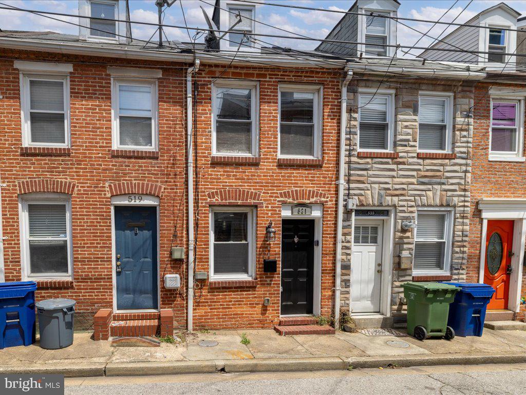 This home puts the Charm in Charm City.  Welcome to 521 S Chapel St, located in the prestigious and highly sought after Upper Fells point neighborhood of Baltimore.  Live the ultimate urban lifestyle in this recently renovated 2 story row home.  Nestled on a quiet one way street, this home features 2 beds, 1.5 baths, the classic Baltimore - esque exposed brick, new waterproof luxury vinyl plank flooring throughout. recessed LED lighting, central air, galley kitchen with granite counters and stainless steel appliances as well as access to your very own private outdoor patio.   Outside your door, explore the eclectic charm of Fells Point, with its cobblestone streets, boutique shops, and award-winning restaurants just steps away. Take a stroll along the waterfront promenade, or hop on a water taxi to explore nearby attractions such as the Harbor East Development and the Inner Harbor. For those craving outdoor adventure, Patterson Park and Canton Waterfront Park offer endless opportunities for recreation and relaxation.  Close to Johns Hopkins Hospital and ideal for hospital workers working late shifts which also makes this property an excellent  investment property.  Easy access to major highways and public transportation.   Don't miss your chance to own a piece of history in one of Baltimore's most coveted neighborhoods.  Available furnished or un furnished. Schedule your tour today!