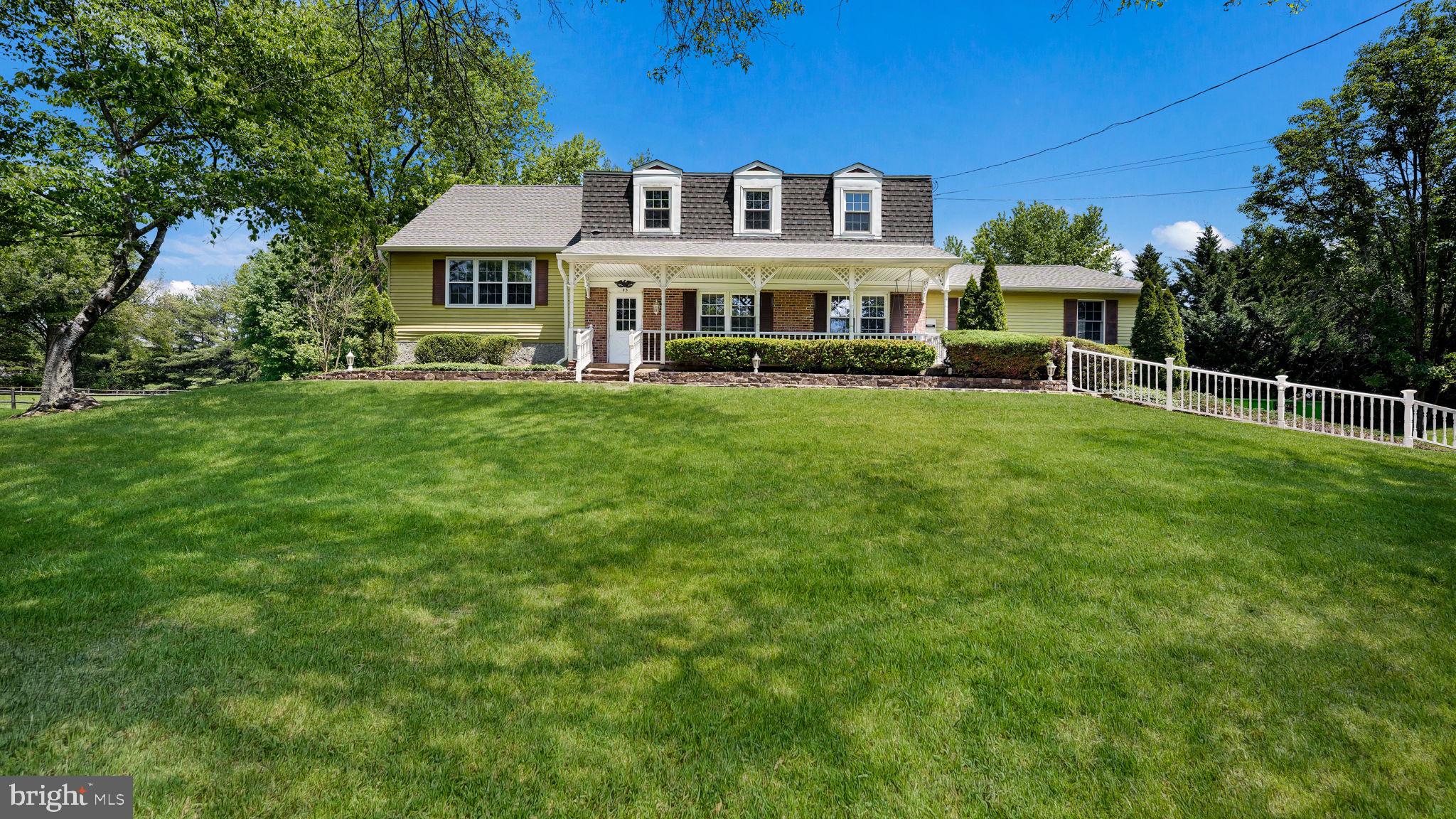 STOP CHASING SQUIRRELS and come get this one!

This Dutch Colonial offers a spacious design ready for your personal touches. First time offered since 1983, this home is tucked away on an acre of beautiful, mature grounds in an ideal Doylestown location. A long driveway, stone walkways, and mature landscaping create a welcoming first impression as you arrive at this well-loved home.

Inside, the flexible floor plan offers exceptional living space with three separate family/living areas, including the game room already set up for you to entertain. The floor plan offers space for everyone to spread out, have fun, work from home, or room to find a quiet place to relax. There is a screened-in rear porch that overlooks the gorgeous backyard setting and the large covered front porch creates that extra curb appeal both providing locations to enjoy peaceful mornings or hanging out in the evening.

Recent updates include fresh paint throughout, new carpeting, and luxury vinyl plank flooring, leaving just a few final touches for the next owner to make it their own. Additional highlights include a two-car attached garage, spacious rooms, and a layout full of possibilities. The owners are also in the process of hooking up to public sewer.

A rare opportunity to own a classic home with space, privacy, and endless potential in one of Doylestown’s most convenient locations.