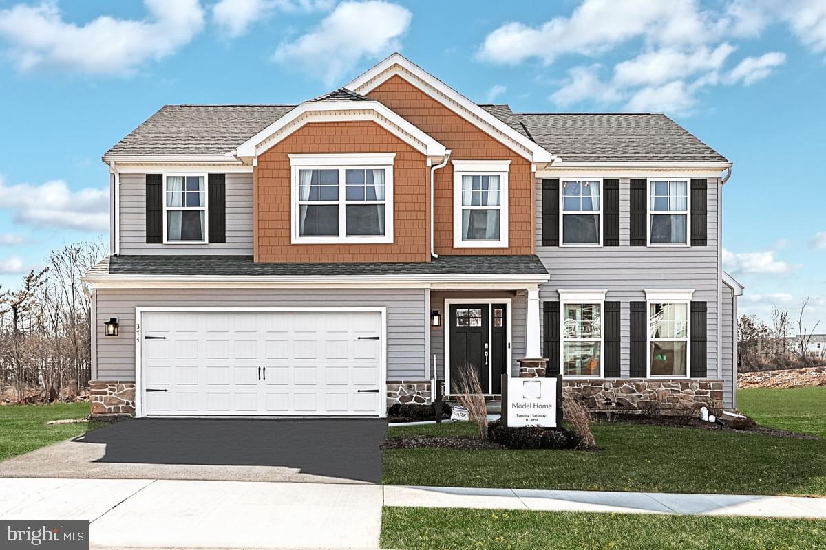 Fully furnished and move-in ready — this is the Blue Ridge model home at Logan Greene, and it's available now. Every room has been professionally designed and styled, and the furnishings are included in the purchase price. This is a rare opportunity to skip the decorating and step straight into a home that's already done beautifully.

The Blue Ridge delivers a thoughtful, open layout with 4 bedrooms, 2.5 baths, and a second-floor loft that gives the home a natural sense of ease and flow. On the main level, the morning room addition floods the kitchen and breakfast area with light, anchoring a chef-friendly kitchen package complete with granite counters, stainless undermount sink, island with pendant lighting, and recessed lights throughout. The enclosed study off the foyer — with its triple window bay — makes a polished, private workspace. A custom mudroom bench with v-groove paneling and transom window keeps arrivals organized.

Upstairs, the primary suite is finished to impress: tray ceiling, recessed lighting, double bowl vanity, and a 60" tile shower with seat, mosaic niche, and sliding glass door. Three additional bedrooms, a second full bath, and a convenient second-floor laundry round out the upper level.

The walkout daylight basement with 9' foundation walls and a 3-piece rough-in adds over 1,000 square feet of future potential. Out back, a 14' × 10' Azek composite deck is the perfect place to wind down. Stone-to-sill front elevation, 3-tone interior paint, French door refrigerator, 2-car garage with LiftMaster opener.

Photos may be digitally enhanced.