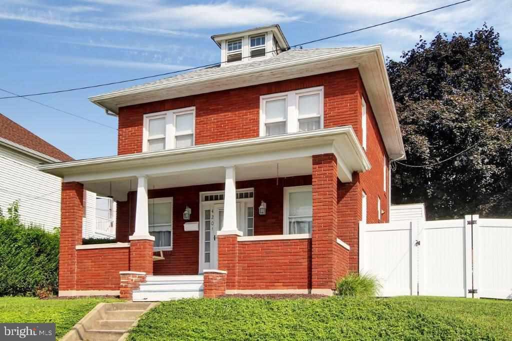 Filled w/ character, this 3BR, 1.5BA, 2-story has cherry KIT cabinets (Rojahn), new backsplash, laminate flrs, updated baths, large LR & DR, FR w/ exposed brick wall, wood flrs in 2 BRS, replacement windows, new roof, walk-up floored attic, rear deck, partially fenced yard, 2-story barn/GAR.