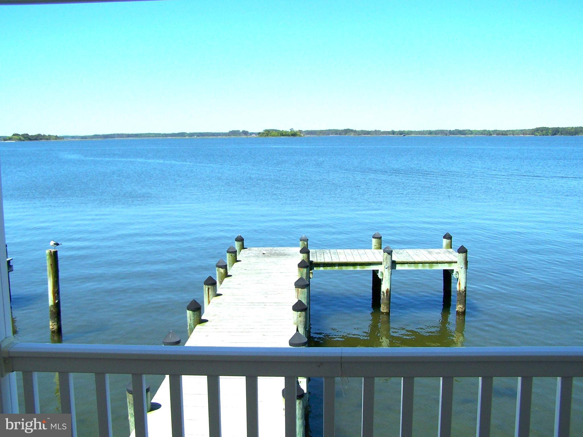 RARE OPPORTUNITY to own a DIRECT BAYFRONT property in the highly sought after community of MONTEGO BAY in North OC!! Built in 1988, this spacious residence offers 1,536 sq. ft. of comfortable living space, featuring three cozy bedrooms and two full bathrooms, perfect for relaxation and privacy. Enjoy the convenience of a furnished interior, ready for you to make it your own. Upgrades include a newer HVAC system (2023) and a newer hot water heater (2023). Step outside on the rear deck to embrace the breathtaking bay views where you will experience stunning sunsets every evening! Featuring a private dock and pier, (replaced in 2019) this home is ready for you to enjoy boating/watersports right from your back door. Community amenities include 2 inground swimming pools, 1 kiddie pool, 2 tennis courts, pickle ball courts, a shuffleboard court, a 9 hole mini-golf course, a wildlife sanctuary/park area with a blacktop walking/jogging path, and a bayfront boardwalk with 3 fishing/crabbing piers...all for a low hoa fee of $415.00 a year.  This home is not just a place to live; it's a lifestyle waiting to be embraced. Don't miss out, call now to schedule your private showing.