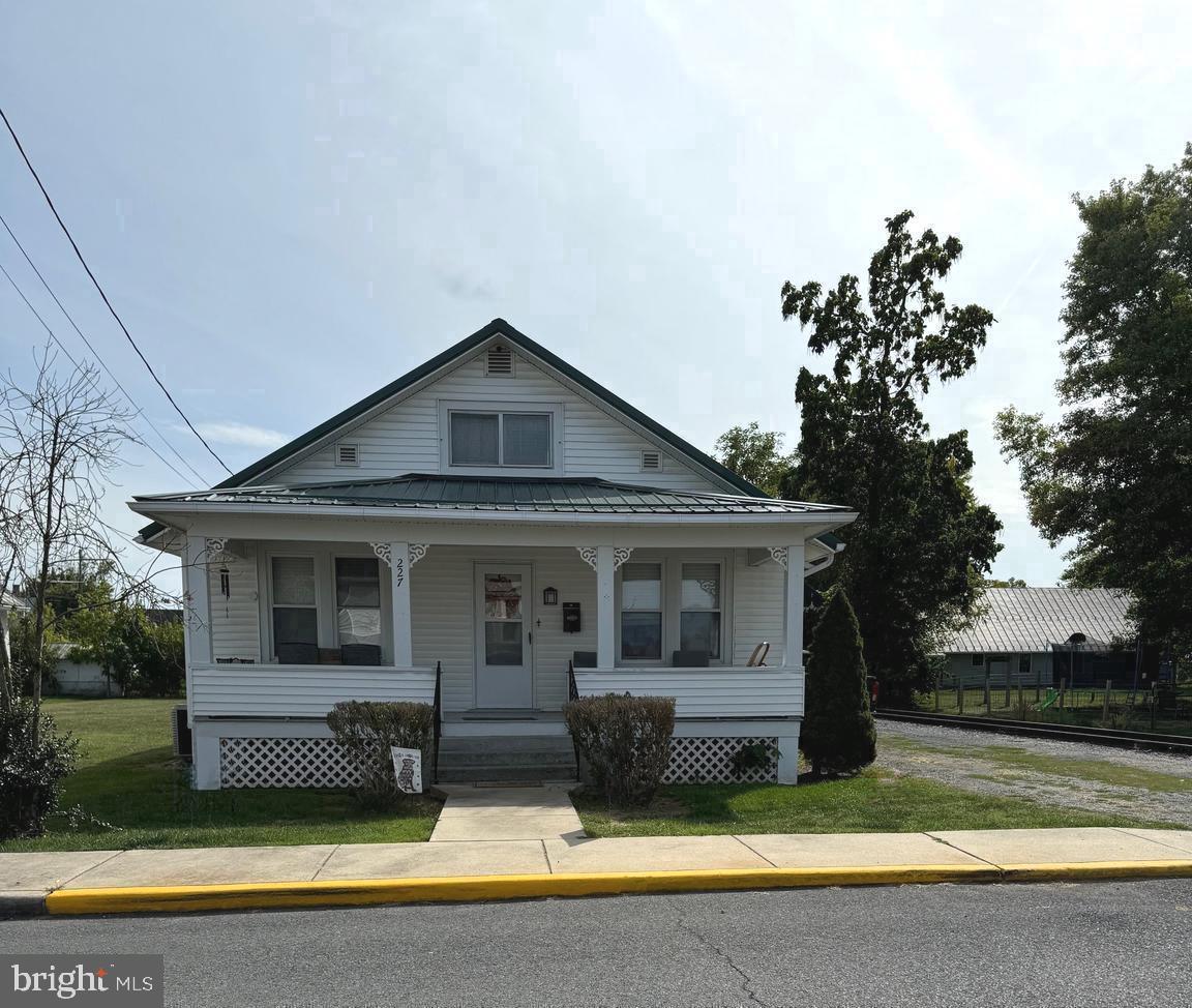 Newly renovated 3 BR, 2 BA Cape Cod house conveniently located in town near to shopping, schools and businesses. New metal roof, new paint,  all new HVAC system and hot water heater (both natural gas),  new 200 AMP electric service.  Partial unfinished basement, carport and detached garage (20' x 24'). Additional building previously used as an office (12' x 18').  Fenced backyard.  Newer stainless steel appliances including washer and dryer.  Schedule appointment today.