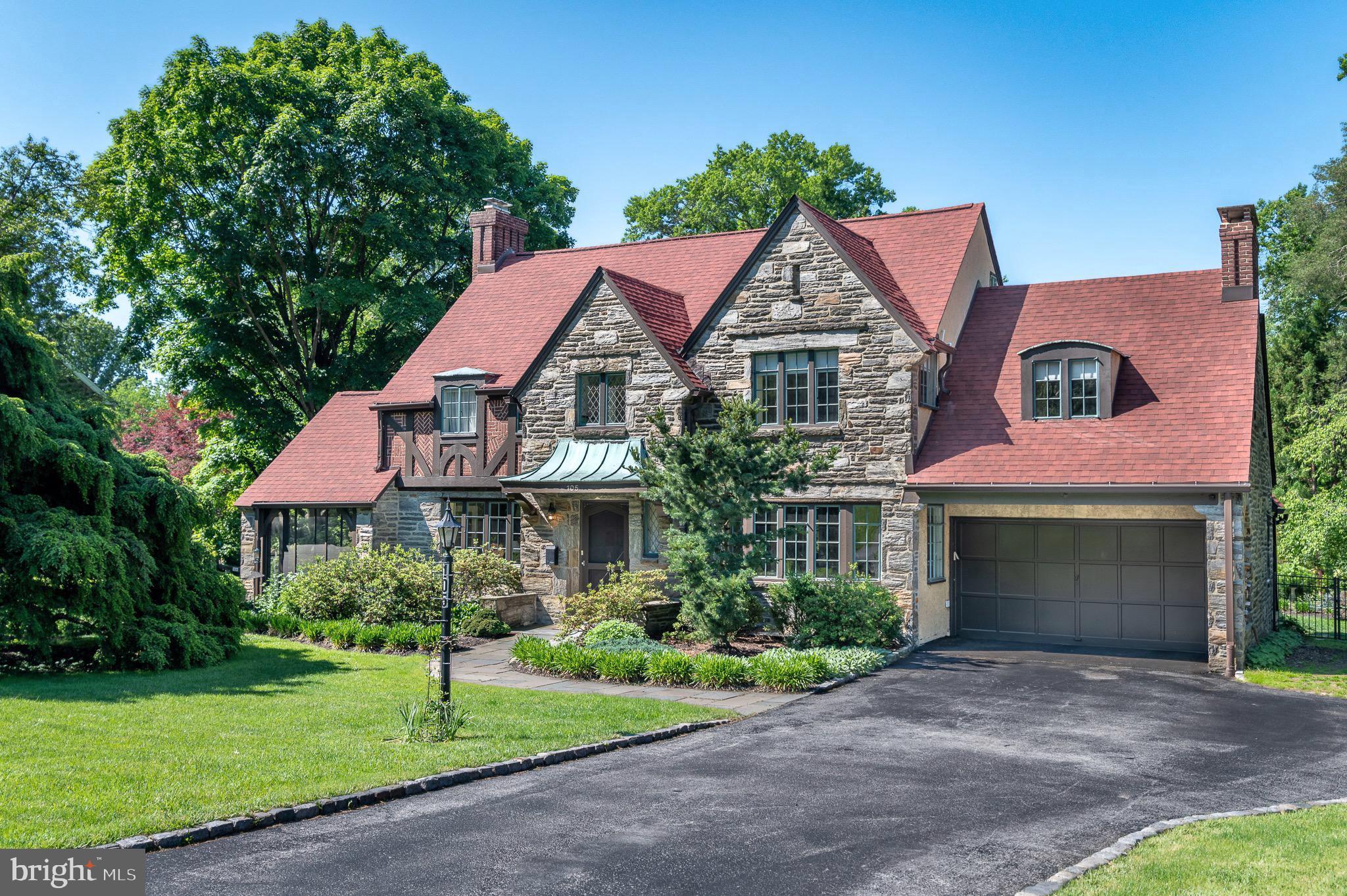 OPEN HOUSE SAT 6/20, 11:00AM - 1:00PM. Welcome to 105 Stratford Road, a striking stone Tudor in the desirable enclave of Wallingford Hills. Driving in feels wonderfully removed from the pace of everyday life, with timeless homes, mature landscaping, and flowering trees creating the atmosphere of a quaint storybook village. The home exudes the craftsmanship and enduring quality of a bygone era. With its handsome stone masonry, intricate patterned brickwork, decorative half-timbering and steel-casement windows, this Tudor residence offers extraordinary character and architectural authenticity. It offers over 3,700 square feet of total living space and features 4 bedrooms with 2 full baths / 3 half baths, and a partially finished basement.

Inside, numerous windows fill the home with natural light. The expansive living room centers around a lovely fireplace and flows seamlessly to a screened porch, creating an inviting space for both entertaining and everyday living. The gracious dining room comfortably accommodates large gatherings with ease. The updated kitchen features granite countertops, premium stainless steel appliances, and an oversized Dacor range. Just beyond, a mudroom connects directly to the garage and basement storage area. At the end of the center hall, an intimate den provides the perfect retreat for relaxing mornings/evenings, and allows access to the fenced back yard.

The second floor offers an ideal balance of charm and practicality with four spacious bedrooms, two full baths, a half bath, and laundry area, The primary suite is both elegant and comfortable, complete with a dressing area and en suite bath. A vaulted guest bedroom features a private half bath with stackable washer/dryer. Two additional generously sized bedrooms share a hall bath. A walk-up attic provides easy access for storage.

The finished lower level expands the home’s living space with another impressive stone fireplace, wet bar, powder room, full laundry area, office alcove, and abundant storage — ideal for movie nights, game days, or hosting guests.

Outside, the grounds are equally captivating. Distinctive plantings and specimen trees frame the property beautifully. Lush greenery provides ample privacy for relaxation. The expansive and fully fenced two-tiered rear lawn offers exceptional versatility, equally suited for play, pets, or elegant outdoor entertaining.

Recent valuable upgrades include: new roof & gutters (2024), backyard fencing (2024), addition of central air conditioning on the main level (2024), and a new sewer lateral (2023).

Ideally located within the award-winning Wallingford-Swarthmore School District, the home is within walking distance to the train station and just minutes from the shops and restaurants of Media, major roadways, and Philadelphia International Airport.

Wallingford Hills is more than a neighborhood — it is a true community. Residents enjoy long standing traditions including block parties, Oktoberfest celebrations, and holiday get-togethers - all contributing to the warm and connected atmosphere that makes it so special. Opportunities to own a home of this character, scale, and provenance in Wallingford Hills are exceedingly rare. Don’t miss your chance to be a part of this very special community.