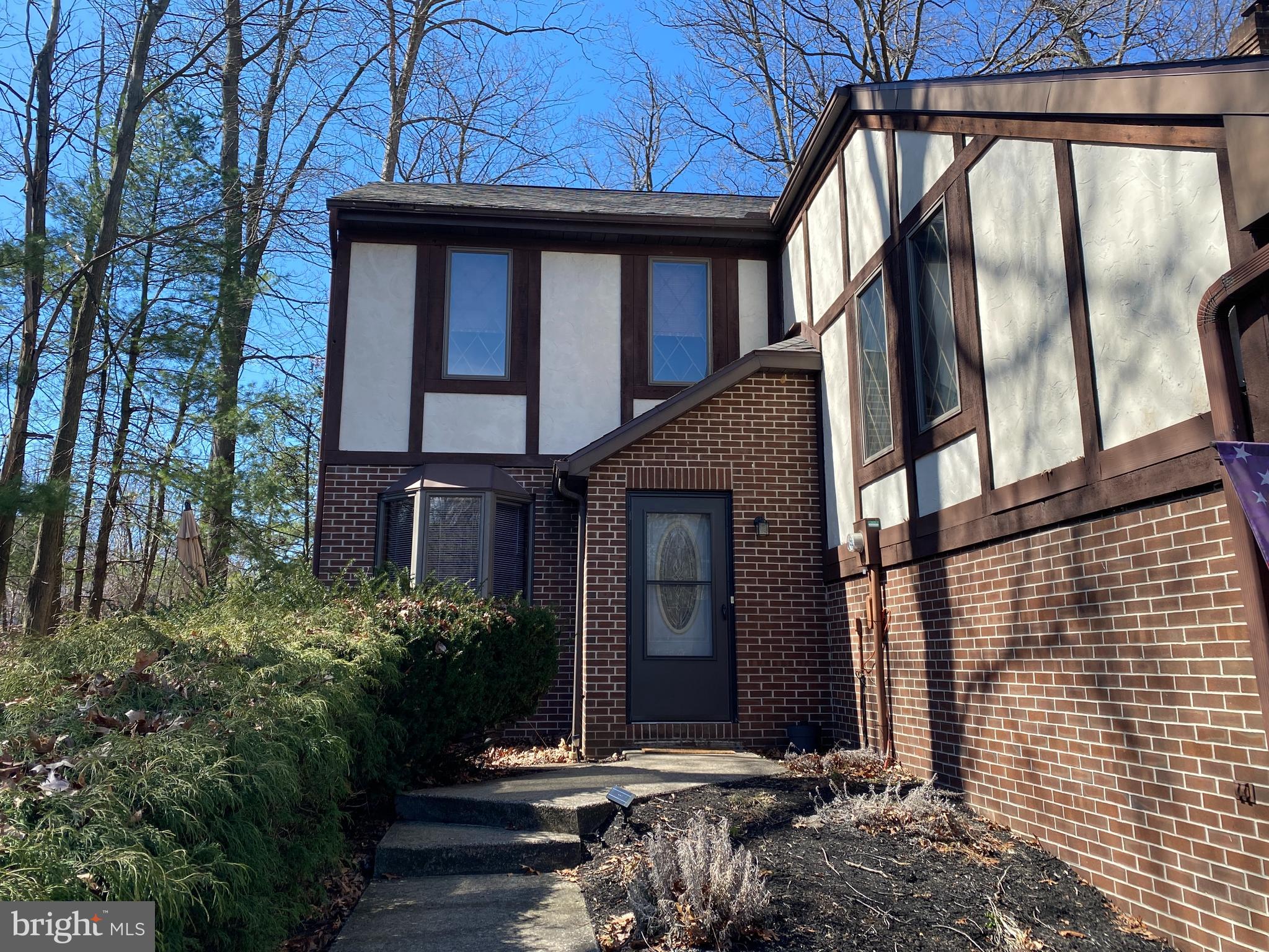 Enjoy the benefits of home ownership with no HOA fees! This spacious townhome is tucked away at the end of a peaceful cul de sac. Features include an open-concept living area, a kitchen with an island & stainless appliances, all adjoining a new sunroom to capture views of the woods behind.  The second floor boasts a private owner suite complete with an updated, high-end bath and a large walk-in closet. This bedroom is big enough for a California king-size bed! On the third level, we have two more spacious bedrooms with walk-in closets and a newly remodeled bath. Each bedroom offers plenty of natural light with lots of windows.  The deck and sunroom provide the perfect place to relax and enjoy the view of the private wooded yard. Lots of recent improvements, including updated bathrooms, a newer roof (2022), a new hot water heater (2024), a newer furnace (2021), new carpeting in the hallway, and 2 bedrooms (2025). This well-maintained home is move-in ready!