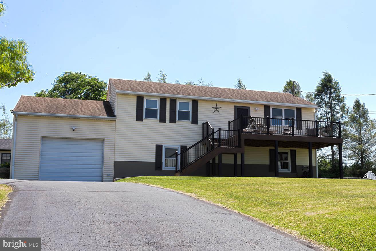 The list of updates is long and impressive for this beautiful Lake Wynonah 3 bed, 1 bath raised rancher located in one of the premier communities in Schuylkill County, Schuylkill Haven School District. A small sampling of the great features includes all new windows and shutters, new decks installed on the front and rear built with Fiberon composite decking, metal roof on the rear deck, warm neutral colors, bamboo flooring, all updated PEX plumbing, completely redone lower level from the studs out, completely remodeled and updated bathroom with luxury vinyl plank and KraftMaid Cabinetry, easy step shower and rain shower head, new front door and slider doors and new large exterior shed (2025) with a full garage door and electric and a separate panel. There is a full comprehensive list of all of the wonderful updates and features available upon request. In a time where many buyers say they can't find a great home at an affordable price that doesn't need a ton of work, look no further, you found the home. The total cost of ownership is affordable, and the home is convenient to shopping, dining and easy access to Rt 183 and I78. Do not hesitate on this one, set up your personal showing today. Fawn Lake is separate from Lake Wynonah. Fawn Lake is a private 27-acre lake that allows non-motorized and electric only boating, swimming and fishing and a dedicated boat launch. The damn/spillway for Fawn Lake was rebuilt in 2009.
