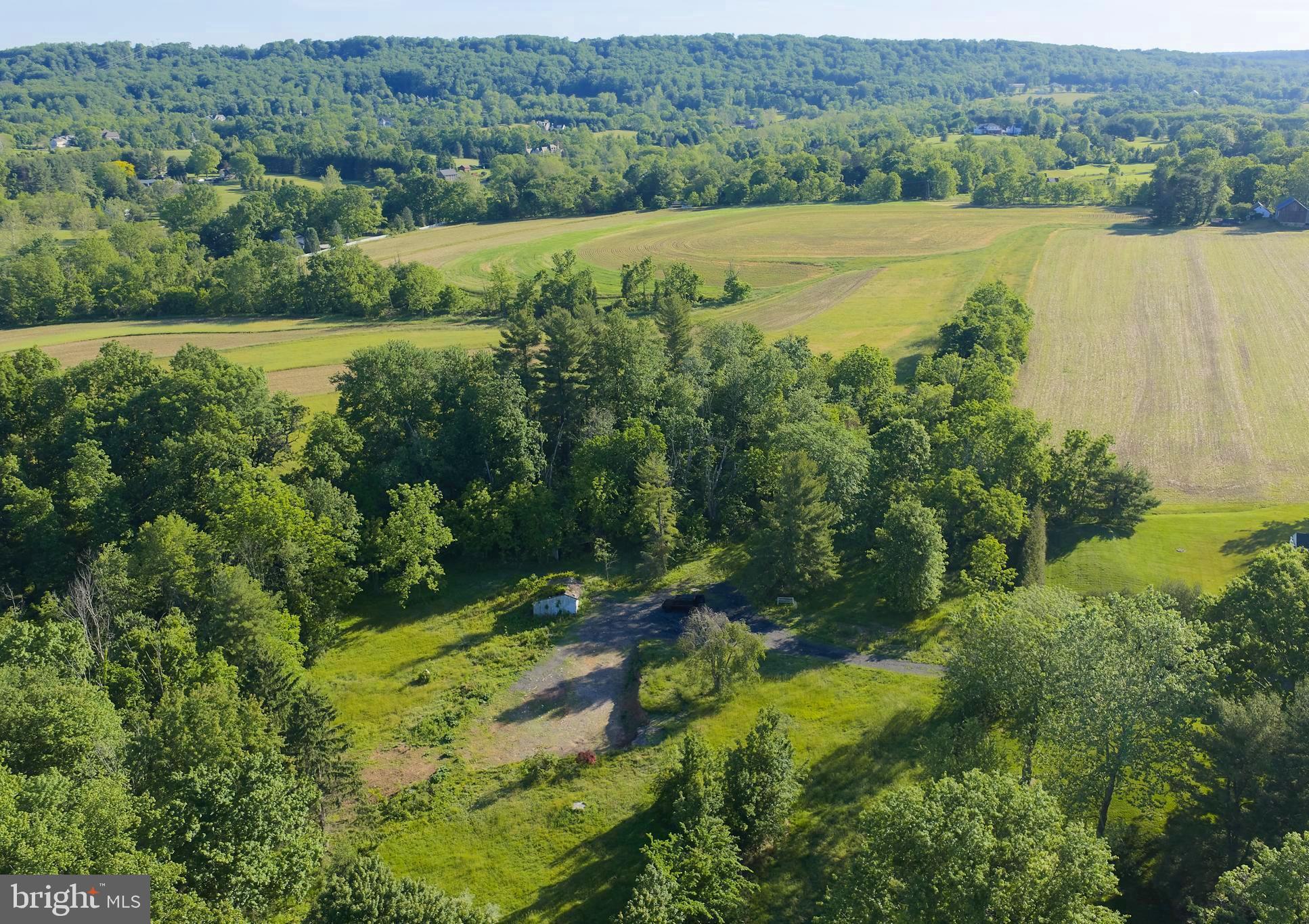 Bring your vision to life on this fully approved, four-acre buildable lot. Privately set down a long driveway with serene wooded views and a backdrop of protected parkland, this rare offering invites you to bring your own builder and create a custom residence in a naturally beautiful setting.  Price is for land, site work and permitting/approvals. Build not included. Renderings by Luce Architects. Motivated Sellers, offers are encouraged.