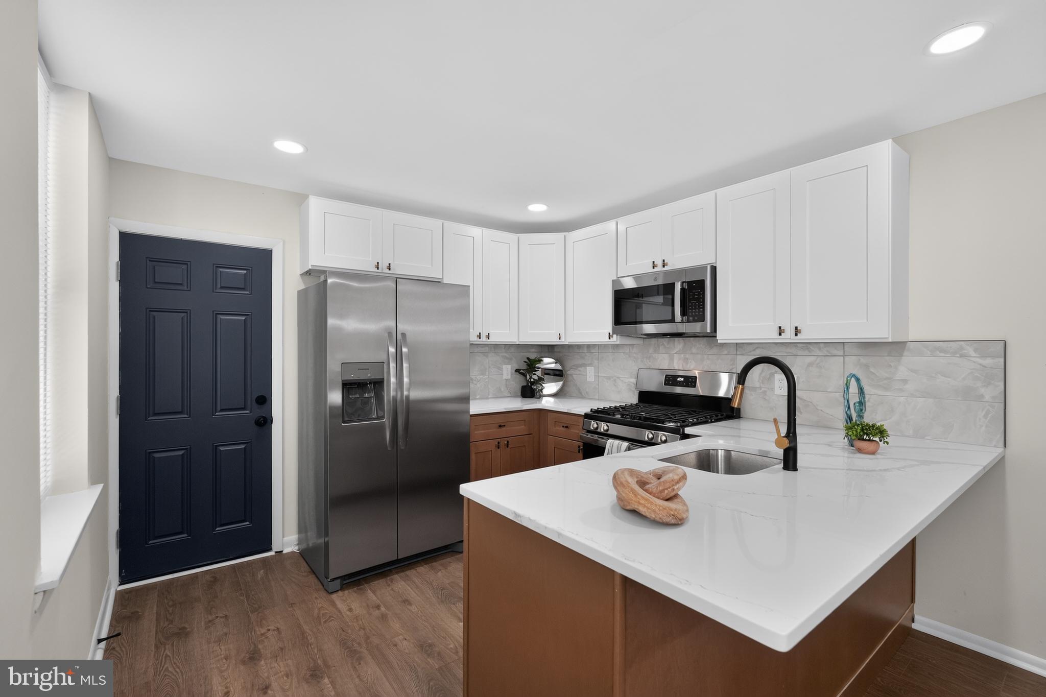 Welcome to 4437 N. 19th Street, a beautifully renovated home that combines modern finishes with timeless style. Step inside to find brand-new laminate wood flooring flowing throughout the spacious living room, dining room, and kitchen, creating a warm and inviting atmosphere.
The stunning, fully renovated kitchen is sure to impress with its stylish two-tone shaker cabinetry featuring rich wood-tone lower cabinets and crisp white upper cabinets, complemented by gorgeous granite countertops, stainless steel appliances, eye-catching accent hardware, and a beautiful ceramic tile backsplash.
Upstairs, you'll find three spacious bedrooms, each featuring brand-new wall-to-wall plush carpeting for added comfort. The fully renovated bathroom offers a fresh, modern design with a new vanity, commode, ceramic tile flooring, and a beautifully tiled shower surround.
The partially finished basement provides valuable additional living or storage space with new laminate wood flooring and freshly parged walls, making it a versatile extension of the home.
With its thoughtful renovations, stylish finishes, and move-in-ready condition, this home is an outstanding opportunity. Schedule your private showing today before it's gone!