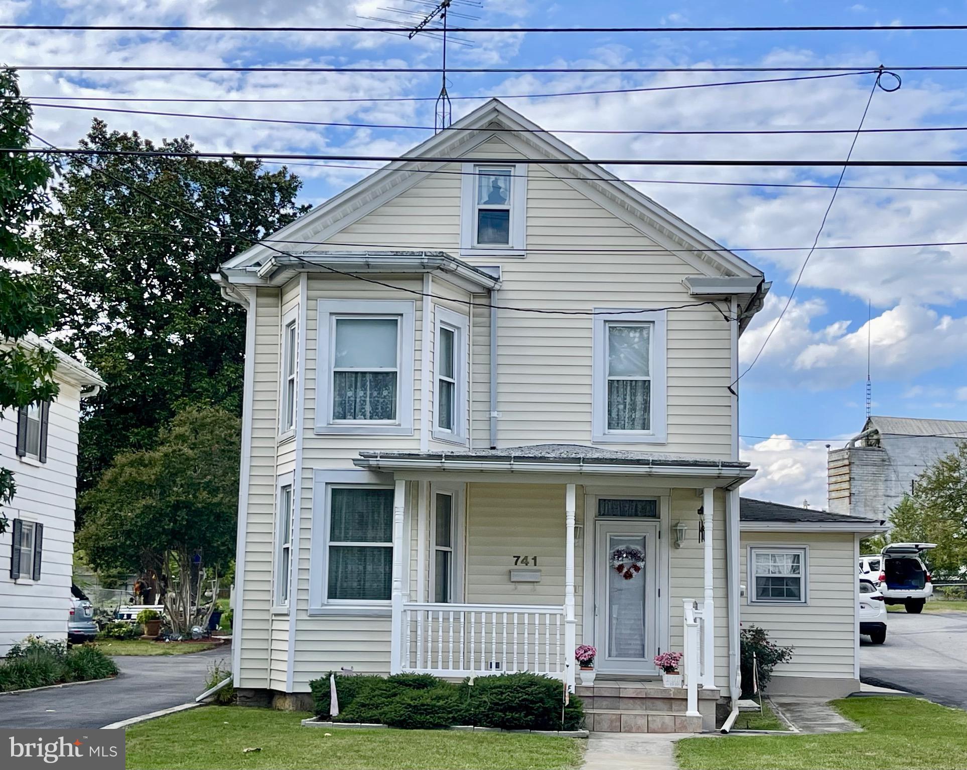 Calling All Vintage Home Lovers! This cute Victorian, circa 1900 has been meticulously maintained and cared for.  The home boasts a very large kitchen that can accommodate a kitchen table. Off the kitchen is a side porch with laundry and access to basement.  The dining room can accommodate large dining furniture as will the living room. The floors in both rooms and foyer are gleaming oak hardwood.  The staircase has hardwood under carpet, as does the upstairs hall and bedrooms. There is a small door in the bathroom that leads to a large unfinished attic, which has lots of possibilities as a cool space to finish.  Detached from the house, in the back, is a large 2 car garage/workshop. The yard is very nice and open. The back of the home is fenced along the alley, and could be opened up for alley access to the property.  Plenty of off-street parking as well.  Super close to I-81, shopping, and restaurants. Call for your tour of this gem today!