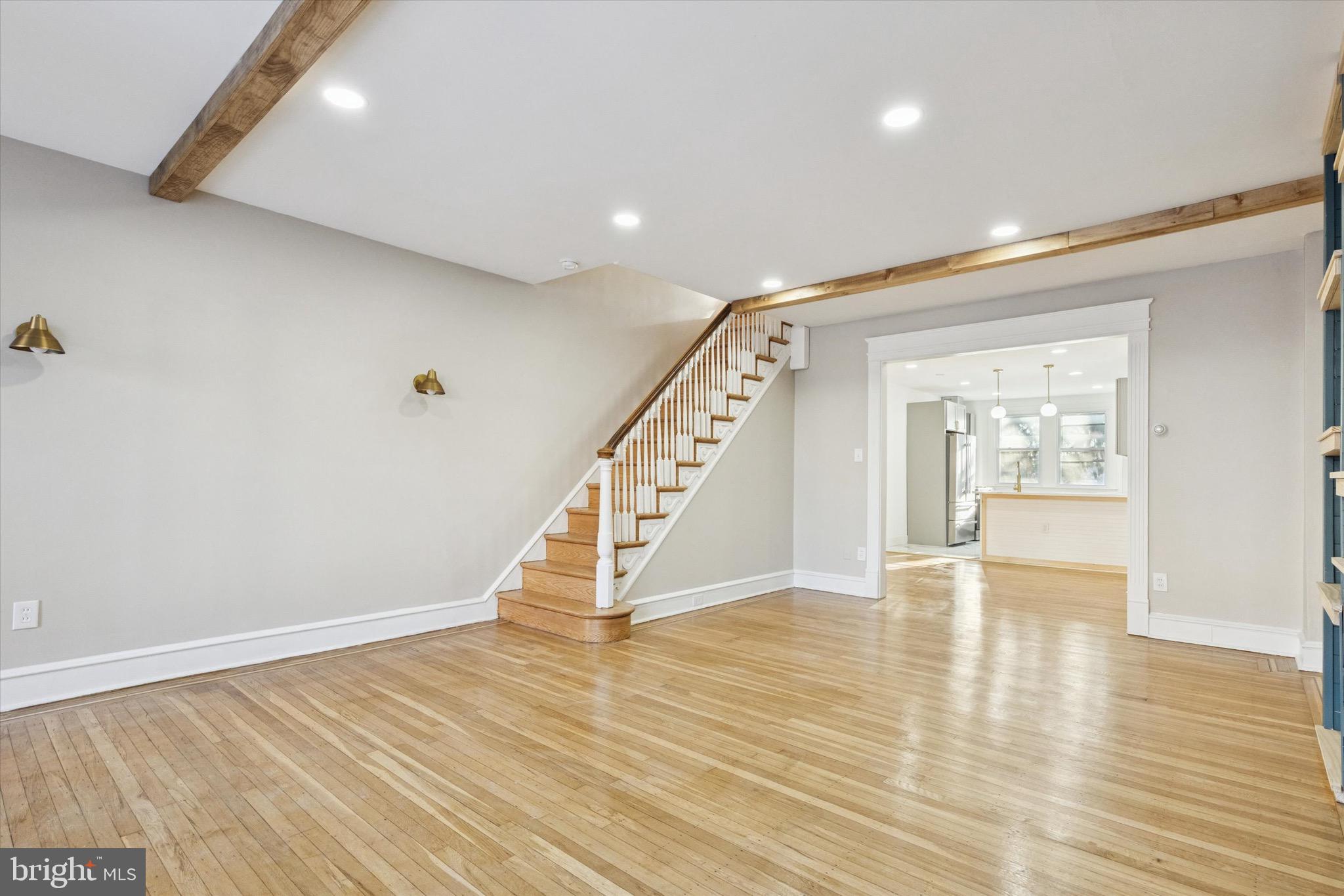 Clean. Chic. Bright and welcoming. Welcome to 7247 Pittville Avenue, a stoned exterior rowhome nestled in the middle of the street. This West Oak Lane gem presents with a sense of warm colors to compliment your sense of style and creativity. This beauty is comprised of exposed beams, a personalized entertainment system, electric fireplace, original hardwood floors (refinished with perfection), recessed lights, gold accents throughout, off-street parking, a gourmet kitchen with granite countertops, an undermount sink, granite countertops with an undermount sink facing the living room. Ascend to the second floor and you'll discover three bedrooms and one hallway bathroom. The 3-piece bathroom was customized with you in mind! Descend to the semi finished basement. The walkout basement includes a half bathroom, access to the garage, laundry hookups, mechanics and an off-street parking space. Minutes from public transportation, PA Turnpike, local shops, storage units and much more. The only thing missing is you!