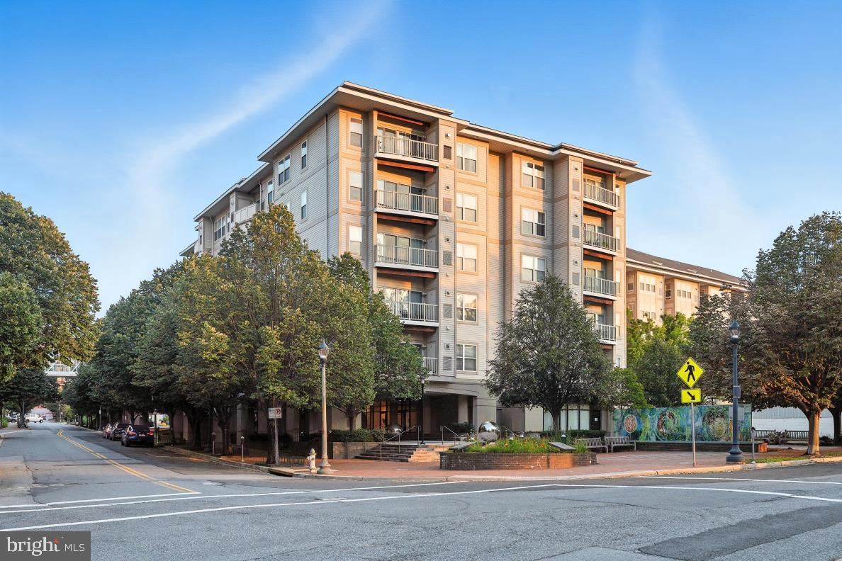 PRICE IMPROVEMENT This unit is located in the vibrant and exciting Downtown Silver Spring. Enjoy the sunrise and glowing sunset throughout the day, with an array of wall to wall/ floor to ceiling windows. This large open space one bedroom unit is what you been searching for. The living /dining space is ideal for entertaining and socializing with family and friends.  There is ideal space off the living room for a home office. Gourmet kitchen with loads of counter space, granite counters, and stainless steel appliances.  The spacious bedroom can easily accommodate a king-sized bed. The bedroom has a huge walk-in closet. Washer/dryer is in the unit. An oversized bathroom is also welcoming for an evening soak. The beautiful crown and rail molding, and hardwood flooring add to the elegance of this unit. The condominium sits on a tree- lined street with a dedicated sitting area with color wall art. The building is pet- friendly. Wonderful fitness center and social room located on the first floor. The area is very convenient and minutes from The Blairs Shopping Center (Giant Foods, CVS, restaurants, and much more). Blocks to Silver Spring Metro or ride the free Route 28 VanGo Circulator that stops directly across the street from the main entrance on Kennett Street. There is parking next door for $95.00 monthly. The owner has meticulously maintained this unit with the pride of ownership.