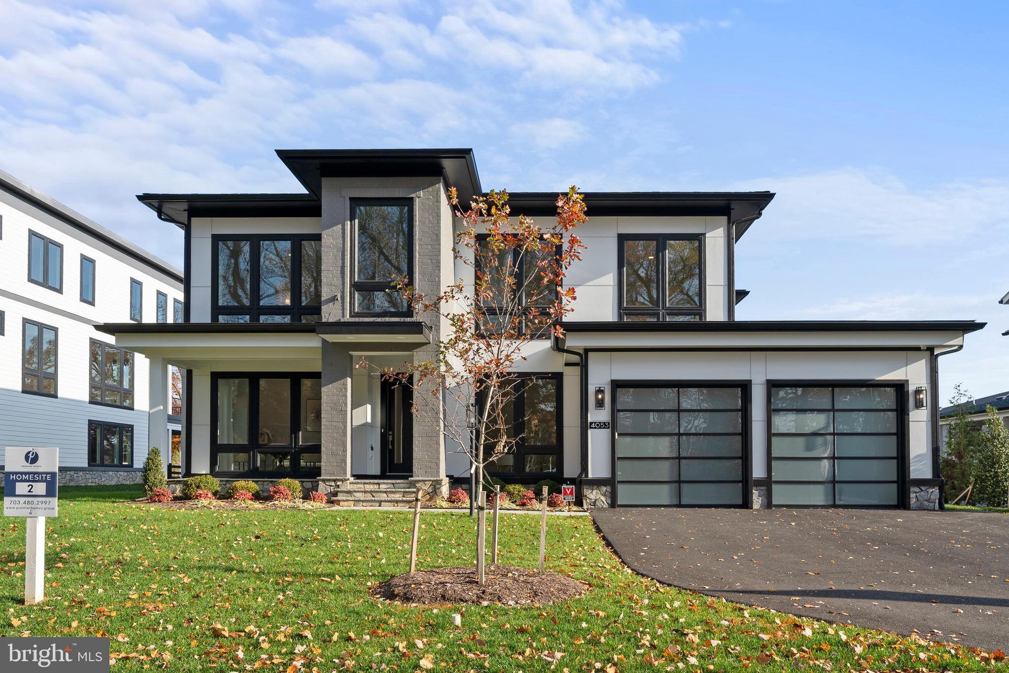 MODEL  4053 Thornton St, Open Thursday-Monday 11-4. Total Constructed Square Footage is 8337 Sq. Ft including 2201 on first floor, 2471 on second floor, 2172 in finished lower level, garage 770, morning room extension 432, screened porch 216, screened balcony 216 and 2nd porch 216.  Presenting a truly unique open-concept floorplan on a generously sized 0.36-acre homesite, this magnificent residence spans an impressive 8329 square feet across all three levels of indoor and outdoor living including garages. With 7.5” European French Oak flooring throughout and 10-foot soaring ceiling heights, this home is a masterpiece of elegance and thoughtful design.
Showcasing remarkable attention to detail, this residence boasts an extensive trim package, featuring 7½-inch baseboards, 7-inch crown moldings, and 4-inch casings around windows and doorways. The sophisticated Quartz countertops in the kitchen and in all seven bathrooms add a touch of luxury, complementing the expansive MI casement windows that flood the entire house with natural light and offer excellent ventilation.  
The kitchen is a culinary dream, equipped with a Top Chef-worthy appliance suite. Stainless steel standouts include a Café™ 48" Smart Dual-Fuel Commercial-Style Range with 6 Burners and Griddle (Natural Gas), a Café™ 48" Smart Built-In Refrigerator, a Café 30” Combination Double Wall oven/microwave, and a Café Smart dishwashing system. The designer kitchen is complete with two-tone Legacy cabinetry, soft-close features, and two stylish island pendant light fixtures, making it the centerpiece of the expansive open-concept family living area.
Designed for seamless indoor/outdoor living, the home features an ample Trex deck with a Pella pocketing 5-panel sliding door, seamlessly extending the living space into an attractive all-season outdoor gathering area. To customize your deck, there’s the popular option to add Phantom motorized retractable screens, ideal for any climate or season, disappearing at the touch of a button.
The main level is complemented by a private in-law suite, strategically located for convenience and accessibility. This thoughtful addition eliminates the need for stairs, making it an ideal arrangement for those seeking both privacy and proximity to the heart of the home.
Extra-wide staircases enhance the grand and open feel, ensuring the upper and lower levels are easily accessible and effortlessly integrated into the overall flow of the home. The upper-level features four curated bedroom suites, each designed to cater to the individual needs of residents and guests.
The Owner's Suite is a luxurious retreat, opening to a charming screened-in porch—a perfect spot to savor morning coffee or unwind in the evening breeze. Inside the suite, a well-appointed sitting area, cozy fireplace, and wet bar create a private retreat. The Owner's Bath features heated floors, a spa-like steam shower, two toilet rooms, and two expansive walk-in closets. The centerpiece of this retreat is a Stargaze freestanding tub, offering a space for ultimate relaxation.
The lower level is a haven for wellness, fitness, and entertainment. A lavish steam room and dry sauna provide a spa-like retreat, complemented by a padded floor gym for invigorating workouts. The stunning waterfall quartz wet bar adds sophistication to the entertainment space, fully equipped with a beverage fridge, microwave, and dishwasher.
The 6th bedroom suite on the lower level offers privacy, featuring a generously sized closet and a beautifully appointed en-suite bathroom. The three-car garage is equipped with an electric car-ready charger, epoxy-coated floors, and strategically placed windows for natural light.
The home is ideally located in a family-friendly community, surrounded by excellent schools, parks, and amenities. With easy access to major highways, commuting is a breeze, allowing for more quality time with loved ones. Google Premier Homes Group to find our website.
