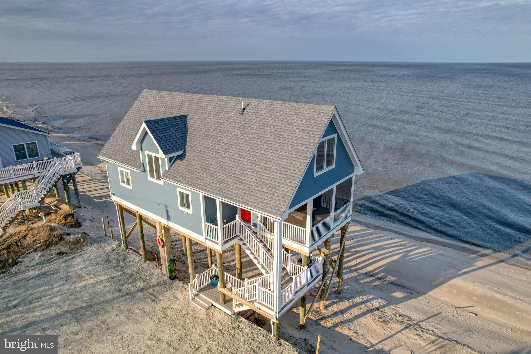 Welcome to 97 S Big Stone Beach Drive — a practically brand-new beachfront retreat on the Delaware Bay. Built in 2024 by a reputable local builder, this stunning custom home offers the rare opportunity to own true waterfront property on Big Stone Beach.

Perfectly suited as a full-time residence, vacation getaway, or income-producing investment, this home is already performing successfully as a short-term rental. Whether you’re looking to relax or generate income, this property delivers both lifestyle and opportunity.

Wake up to breathtaking, unobstructed views of the Delaware Bay from nearly every window. Enjoy spectacular sunrises over the water and serene sunsets that make every day feel like a retreat. Step outside and experience direct beachfront living with approximately 2.5 miles of quiet, natural shoreline to walk, explore, and unwind.

Inside, the home is thoughtfully designed with both style and function in mind. The spacious kitchen is a true centerpiece, featuring abundant storage with soft-close cabinets and drawers, a double oven, and a layout ideal for entertaining or hosting guests. Upgraded Andersen windows flood the home with natural light while maximizing those incredible water views. Durable and stylish LVP flooring runs throughout the home — completely carpet-free for easy maintenance and modern appeal.

Built for efficiency and peace of mind, the home includes a brand-new septic system installed in 2024. Outdoor living is just as impressive, with low-maintenance Trex decking and a screened-in porch perfect for enjoying the coastal breeze, dining outdoors, or simply relaxing in the peaceful surroundings.

Nestled off the beaten path, Big Stone Beach offers a unique blend of privacy, tranquility, and natural beauty. The area is rich with wildlife and coastal charm, creating the perfect setting for those looking to escape the hustle while still being within reach of nearby amenities.

With parking for up to six vehicles, there is plenty of space for family, friends, and guests. Additional highlights include low annual property taxes (under $1,700), making this an attractive option for both homeowners and investors alike.

Beachfront properties like this — especially newer construction, custom-built, and with proven rental income — are incredibly rare. Don’t miss your chance to own a slice of Delaware Bay paradise.