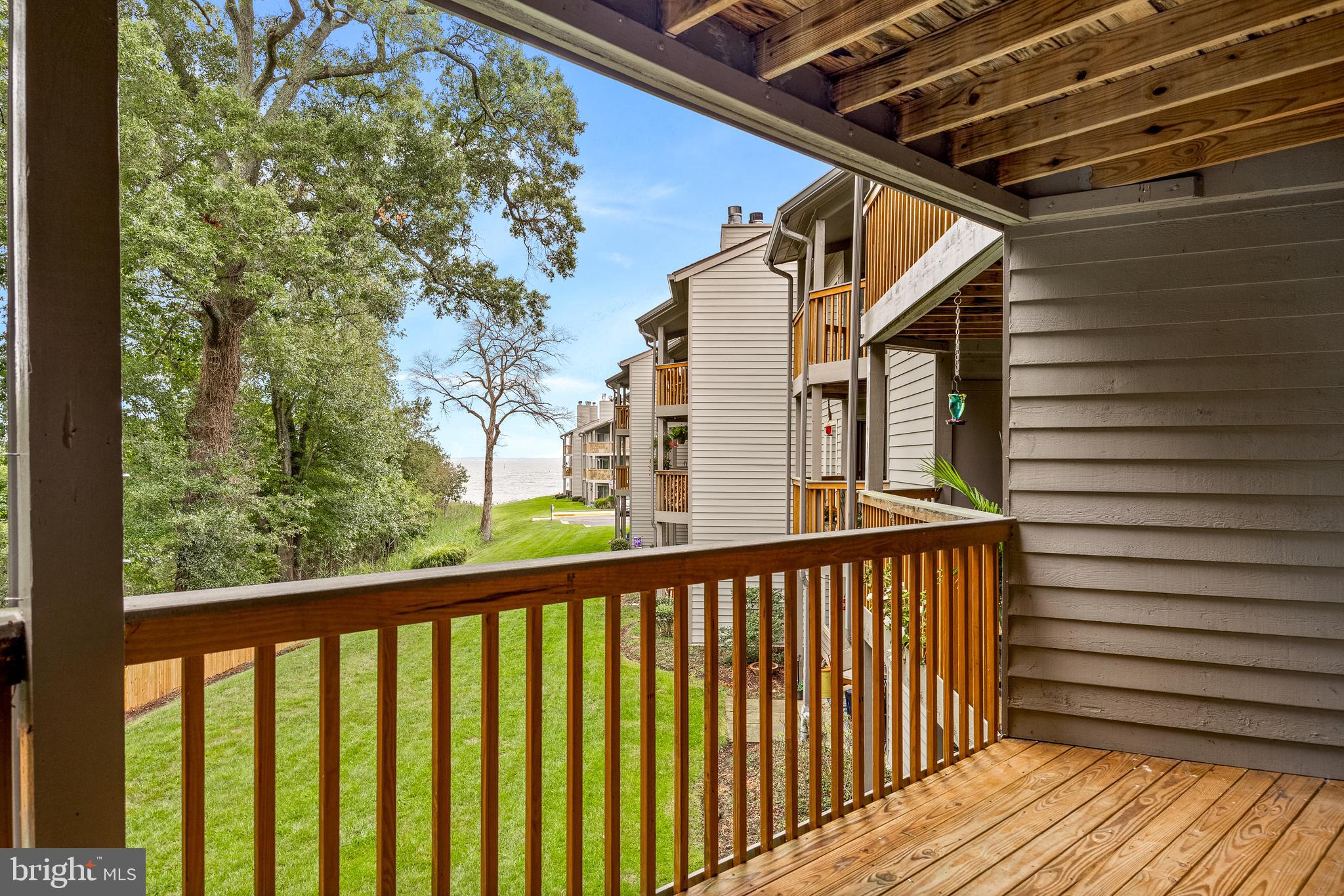 The Seasons change the views. Tremendous price reduction.  A great opportunity just before the summer.  Quiet tranquil setting for this 2 bedroom 2 bath unit with a view of the Bay in the distance,   Windows in second bedroom replaced in 2024. To be sold in  As-is condition.  Enjoy the community amenities - 24 hour security, swimming pools, tennis courts, a beach and walking trails.  Bay Ridge Rd. to Route 50 and 97 to DC and Baltimore. Easy to show, just call Showings to log in.