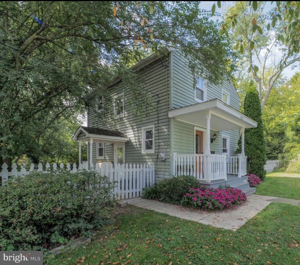 Welcome home to 422 Ford St. and the enjoyment of NO HOA! Use your imagination for your space-park your boat, camper or multiple items with ease.  Tucked away at the end of the quiet dead-end street, this charming home offers the best of quaint town living with added privacy.  Sitting on a .24 ac lot, the property features a fenced side and rear yard with a classic picket fence and attractive landscaping.  Enjoy not one, but two covered porches-perfect for relaxing.  Inside, you'll love the hardwood flooring on both levels, tile in the kitchen and bath, and the eye-catching quarter-turn top & bottom staircase with banister adds character and charm.   A convenient side entrance leads to the basement and several steps up to the kitchen.  the gravel driveway and double gate entry provide the flexibility to drive through to the backyard-ideal for your recreational storage.  This lovely home is move-in ready and waiting for you!

HOME IS SOLD "AS IS" BUT IS IN BEAUTIFUL CONDITION.  REAR SHEDS BEING SOLD AS IS CONDITION.