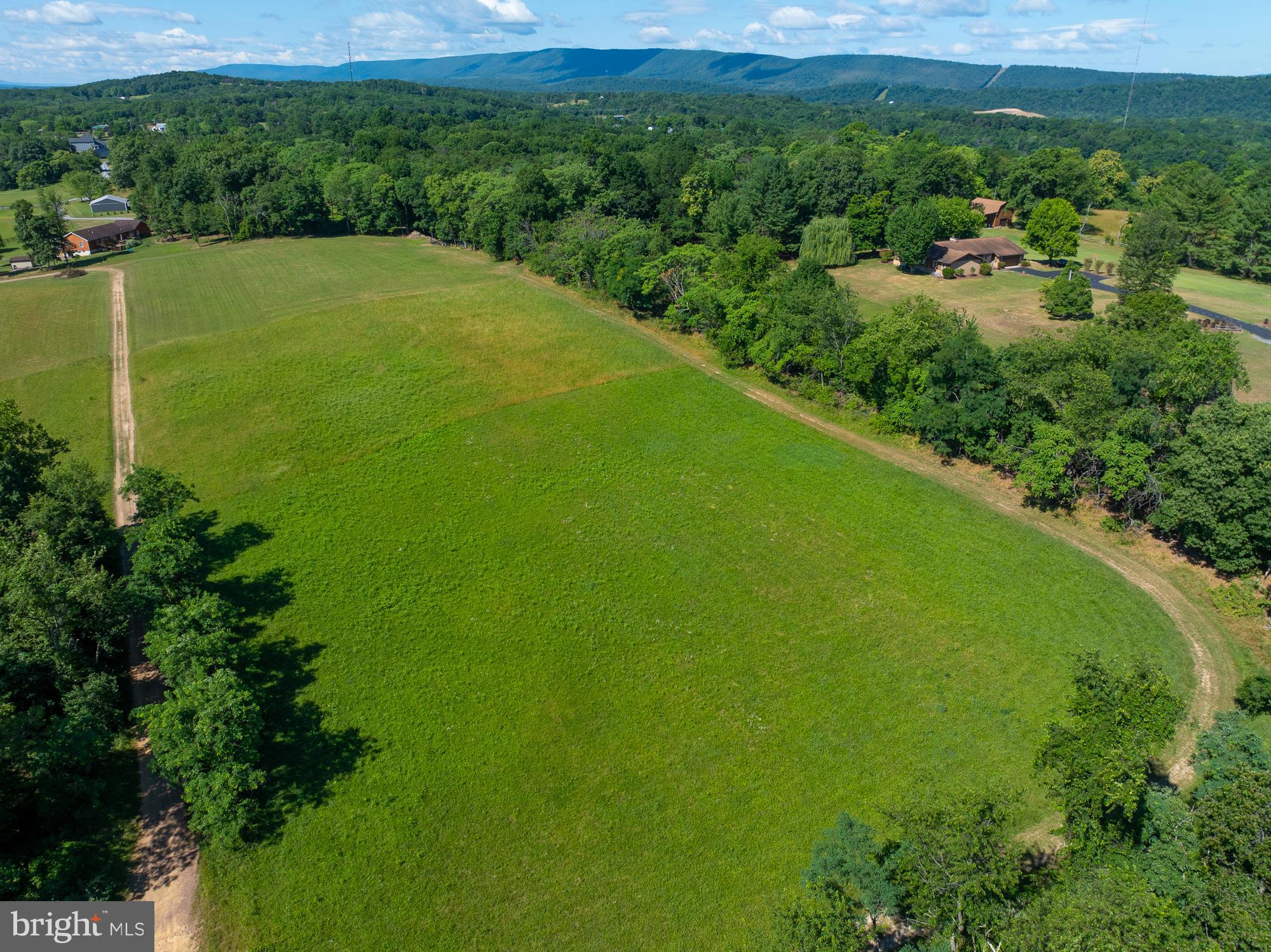 A Beautiful beautiful piece of ground in Berkeley Springs.  3.27 private unrestricted acres with a rural feel but just 15 min from town and10 min from the new bypass which will make accessing Rt 70 lots easier.  The lot is level, mostly cleared , partially wooded, great Mountain views, and in an area of some really nice properties  - a horse farm right down the road as well as some high end homes. The War Memorial Hospital is just a few minutes away -- the grocery store is also close by - about 15 min.  This lot is in a gorgeous part of the county.  If you are thinking of building, then check this out.  I promise you will love it.