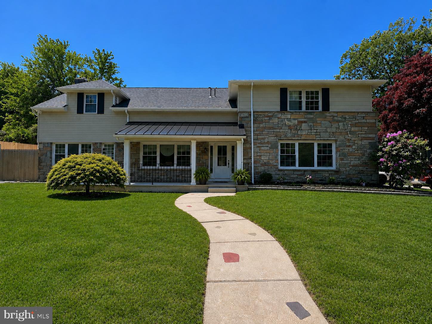 Welcome to 51 Academy Rd — a fully reimagined luxury residence perfectly positioned on a picturesque corner lot in the heart of Bala Cynwyd. Blending timeless architecture with sophisticated modern finishes, this exceptional 5-bedroom, 3 full bath, 2 half bath home offers over 3,600 + square feet of beautifully designed living space within the award-winning Lower Merion School District.

Surrounded by mature trees and lush wraparound grounds, the home’s classic stone exterior, dual driveways, and oversized 2-car garage create striking curb appeal from the moment you arrive. Inside, wide-plank engineered hardwood flooring, abundant natural light, and thoughtfully curated finishes define the home’s elegant yet comfortable aesthetic.

A welcoming center foyer features a custom built-in mudroom, offering both style and everyday functionality. The expansive living room is drenched in sunlight and provides the perfect setting for entertaining or relaxing with family.

At the center of the home is a stunning open-concept kitchen, dining, and family room designed for modern living. The designer chef’s kitchen showcases custom two-tone cabinetry, premium GE Café appliances, quartz countertops, an oversized statement island, and a fully appointed butler’s pantry. The adjoining dining area is framed by walls of windows, while the inviting family room is anchored by a beautiful stone fireplace, creating a warm and sophisticated gathering space.

The main level also includes a flexible fifth bedroom or private office along with a stylish powder room. This home is perfectly suited for multi-generational living accommodations.

Upstairs, the luxurious primary suite occupies its own private wing and serves as a true retreat, complete with two spacious walk-in closets and a spa-inspired bath featuring dual vanities and an oversized rainfall shower. A secondary ensuite bedroom offers ideal accommodations for guests or family, while two additional generously sized bedrooms, a beautifully finished hall bath, and convenient second-floor laundry complete the upper level.

The expansive lower-level features soaring ceilings and offers endless possibilities for future finished living space, including a media room, fitness studio, playroom, or additional entertaining area.

Step outside to the private rear patio — an ideal backdrop for outdoor dining, summer gatherings, or creating your own secluded backyard oasis. The basement provides endless opportunities for additional living space and included a powder room and fireplace.

Ideally located just minutes from Montgomery Ave, City Ave, Suburban Square, downtown Narberth, and Manayunk, this home offers unmatched convenience to shopping, dining, medical centers, and major commuting routes including I-76 and the Cynwyd Regional Rail line for effortless access to Center City Philadelphia.

Luxury, location, and lifestyle converge at 51 Academy Rd. Schedule your private showing today.