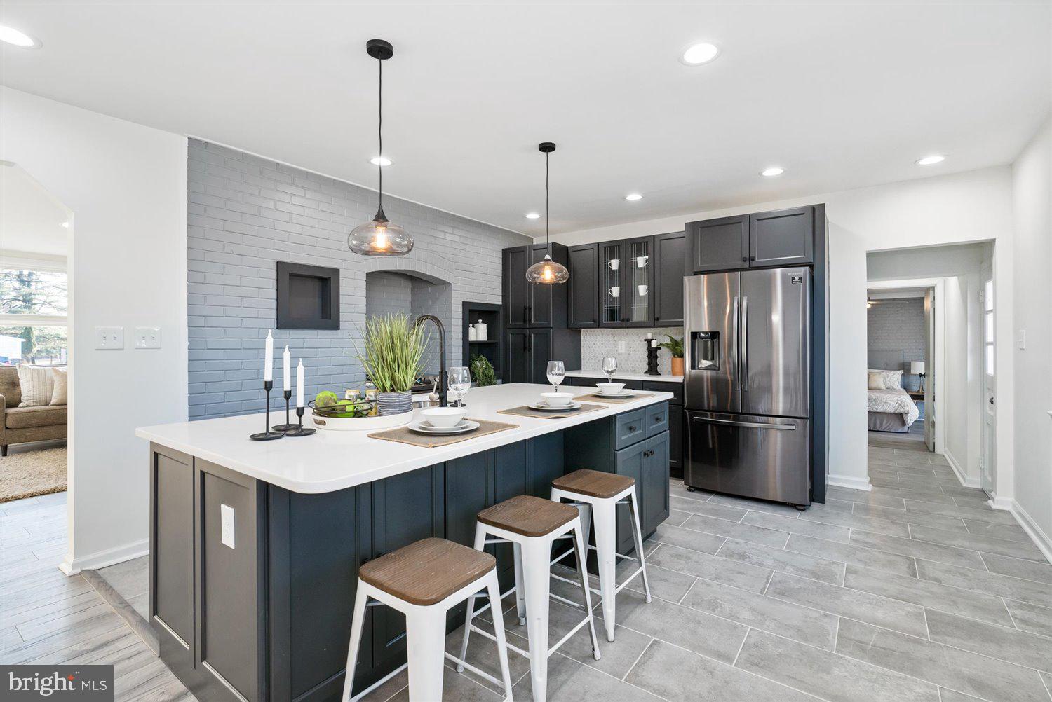 Truly One Of A Kind - Stunning 1900 Sq ft Renovated Rancher In The Heart of  Cockeysville. 4 Bedroom 3 Full Bathrooms! Walk-in & Immediately Be Greeted With An Open-Concept Floor Plan. The Main Level Offers A Living Room Boasting With Natural light With A Warming Fireplace & Dining Room Attached To The Kitchen. The Large Kitchen Gleams With Brand New Stainless Steel Appliances, Quartz Countertops, Soft Closing Cabinets  & Breakfast Island. Continuing Throughout The Home We Have A Large Master Suite With Private Access To The Patio,  Large Walk-In Closet, And Master Bathroom With Dual Vanity Sinks. Throughout The Main Level There Are 3 Additional Spacious Bedrooms &  A Full Bathroom. On The Lower Level Is A Very Large Basement With Recessed Lighting,  Spacious Family Room, Laundry Room, Two Storage Rooms (Possibilities are Endless - You Can Convert One Storage Room to Wine Cellar, Home Gym, Etc) & A Full Bathroom.