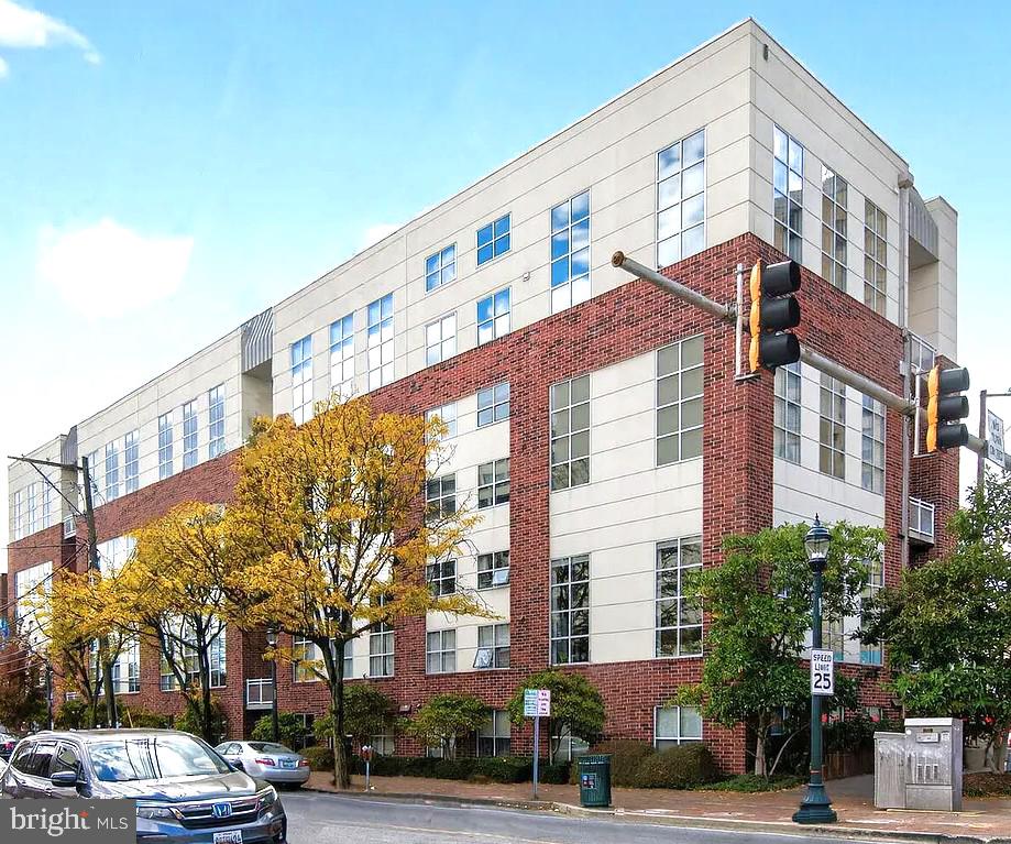 Rare corner unit and one of the largest floorplans in the building, this two story loft in the heart of downtown Silver Spring is enhanced by a loft expansion and features dramatic floor to ceiling windows that highlight the home’s impressive volume and abundant natural light. Soaring ceilings and an open concept layout create spacious living and dining areas that are bright, airy, and highly functional for both everyday living and entertaining.

In addition to a private den, the newly expanded upper level loft overlooks the main living area, enhancing the home’s open, architectural character. These flexible spaces are well suited for a home office, reading area, meditation, creative use, or guest accommodations.

A private balcony extends the living space and provides an inviting outdoor retreat.

Located just blocks from vibrant downtown Silver Spring, the home offers convenient access to the Metro train hub, dining, shopping, and entertainment, supporting a highly walkable, commuter friendly lifestyle.

Additional features include in unit laundry and an assigned parking space.