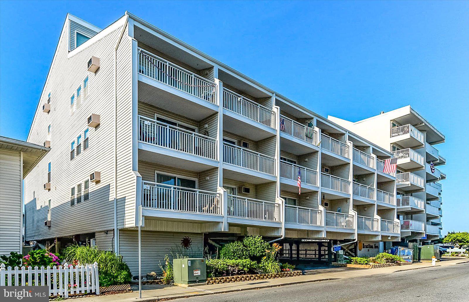 What a great ocean block midtown location that is only 1 building off the oceanfront. This well kept, top floor 2 level condo has a southern exposure balcony to enjoy the ocean view and a bonus view of the bay! The 1st floor has an open floor plan, a fully equipped kitchen with breakfast bar, dining area, living room room, bedroom and a full hall bath.  The 2nd floor is the large loft bedroom that overlooks the dining and living room area. Don't want to deal with the high-rises or larger condo associations? If so, then here it is because Brazilian Sun is only 18 total units and comes with covered assigned parking and a ground level storage locker. This ocean block location at 77th St. is so close to the beach, is conveniently located to many restaurants, shopping, entertainment, miniature golf, allows for easy access in and out of Ocean City via Rt 90 at 62nd St., and only a few miles from the world famous Ocean City Boardwalk!  Time to start making your beach memories here! The reserve study has been completed and there are no special assessments, per management company.