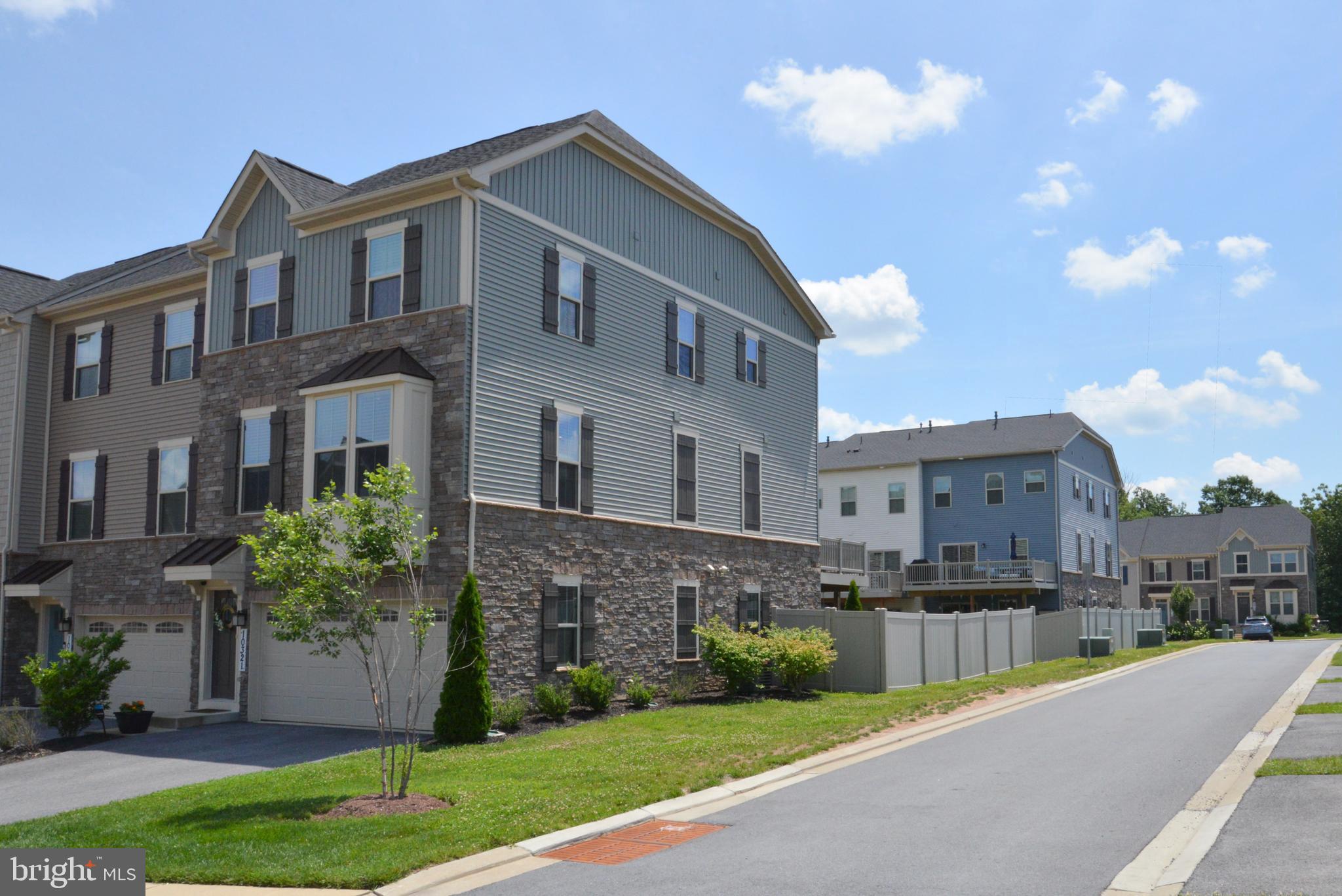 Your Dream Home Awaits in Award-Winning Lake Linganore! Discover the perfect blend of comfort and community in this beautiful end-unit townhouse in New Market's highly sought-after Lake Linganore. It offers a lifestyle designed for modern living, with its newest villages and amenities providing unparalleled convenience and recreation. This stunning home welcomes you with an open floor plan, perfect for today's dynamic lifestyle. The main floor is an entertainer's delight, featuring a large gourmet kitchen with a spacious island that seamlessly flows into a generous dining area and living room. Step outside from here onto a large entertainment deck with durable Trex flooring, ideal for al fresco dining. Upstairs, you'll find three comfortable bedrooms, including a magnificent primary suite. This private sanctuary boasts a large walk-in closet and an ensuite spa-like bathroom, complete with a relaxing soaking tub and a separate walk-in shower. For ultimate convenience, a large laundry room with a utility sink is also thoughtfully located on the bedroom level. The thoughtful design continues with a built-in garage providing easy access to the versatile flex space in the finished walkout basement. This expansive area, featuring an additional full bathroom, can effortlessly transform into a playroom, workout room, home office, or guest suite. From the basement, step out into your fully fenced yard with a patio, offering a private outdoor retreat. Imagine waking up to vacation-like serenity every day! At the heart of this inspiring community is the magnificent freshwater Lake Linganore, offering endless opportunities for outdoor enjoyment and recreation. With community beaches, swimming, boating, hiking, and fishing right at your doorstep. Don't miss your chance to experience resort-style living without ever leaving home! Beyond the lake, this neighborhood offers a diverse array of fantastic amenities. Enjoy sunny days at the community pool, watch the little ones play at the tot lots, and appreciate the convenience of having schools in the community. Daily errands are a breeze with the newly opened Weis Market just around the corner. Don't miss your chance to experience resort-style living without ever leaving home!