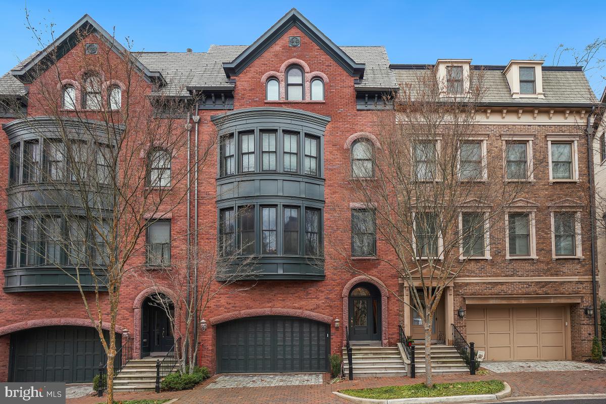 Location, Location Location! Known as Bethesda Magazine’s Readers' Best Luxury Townhome Community, this Windsor Model 4-level townhome is sited on one of Park Potomac’s best lots with lush green views but less than a block from the shops, stores, restaurants, pool and clubhouse of this splendid community. With nearly 4,000 square feet of gracious living space on four elegant levels, this brick Brownstone showcases multi-level bay windows, gleaming hardwoods, crown moldings, built-ins, extensive recessed lighting, a chef’s eat-in kitchen with a 6-burner gas range with warming shelf, 2 sinks, 2 dishwashers, an elevator, and a 2-car garage with extra cabinetry and a storage shelf. The entry level flows seamlessly to the bright informal entertaining area with its wet bar and refrigerator, full bath, 2 large storage closets and exit to the brick patio. Up one flight, the baby grand piano-sized living room is complemented by the large dining room, gourmet kitchen opening the to the deck and the warm family room with its gas fireplace. The light-filled primary bedroom suite—boasting a custom walk-in closet, 2 additional walk-in closets and en-suite bath with its whirlpool tub, shower with a bench, double vanity and private toilet area—highlights the next level. Two more bedrooms with oversized walk-in closets, a hall bath, laundry area and linen closet are also found on this floor. Ascending to the fourth level, the cathedral ceiling loft area showcases a mini-kitchen, wet bar, wine rack, and double-sided gas fireplace. This second entertaining area exits to the glorious rooftop terrace with its Trex flooring. Another bedroom with a walk-in closet, a full bathroom and extra storage finish this floor. Park Potomac residents enjoy individual yard maintenance, snow removal to the front door, pool with lifeguard, club house with exercise and entertaining facilities, tot lot, dog park, walking trails, and free shuttle to the White Flint Metro during the week. Perfectly located, major transportation routes are nearby making commuting a breeze. An easy and sophisticated lifestyle starts here. Don’t miss this great opportunity.