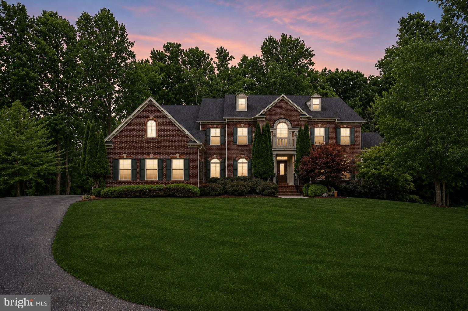 ***PRICE IMPROVEMENT***Welcome to your dream home in the exclusive Oak Hill Estates at Oak Creek—one of Prince George’s County’s premier gated golf communities! This 5+ bedroom, 5.5-bath estate offers over 10,000 sq ft of refined living space designed for both elegance and ease. Perfectly situated on a private cul-de-sac and backing to the 9th hole of the championship golf course, this home blends luxury with functionality at every turn.

Step into the grand 2-story foyer, framed by dual staircases, and be drawn into expansive formal spaces including a sun-drenched solarium, executive home office, and a chef’s kitchen with top-tier appliances and a stunning oversized island. The 2-story family room impresses with soaring windows and a cozy gas fireplace. 

Upstairs, the owner’s suite is a private retreat featuring a double-sided fireplace, a luxurious bath with a jetted soaking tub, Roman-style shower with dual heads, and dual walk-in closets—including an expansive custom walk-in closet ideal for boutique-style wardrobe organization and dressing.

The fully finished walk-out lower level delivers impressive entertaining and guest accommodations with a state-of-the-art home theater, full bar, spacious rec areas, guest suite, and a third gas fireplace for added ambiance and warmth.

Enjoy resort-style amenities including access to the golf course, clubhouse, pool, tennis courts, and scenic trails—all within a gated community offering 24/7 access control. Ideally located just 30 minutes from Washington, D.C., 30 minutes from Annapolis, and only 5 minutes from the new Southlake Shopping Center, this estate offers luxury living in a prime and connected location.