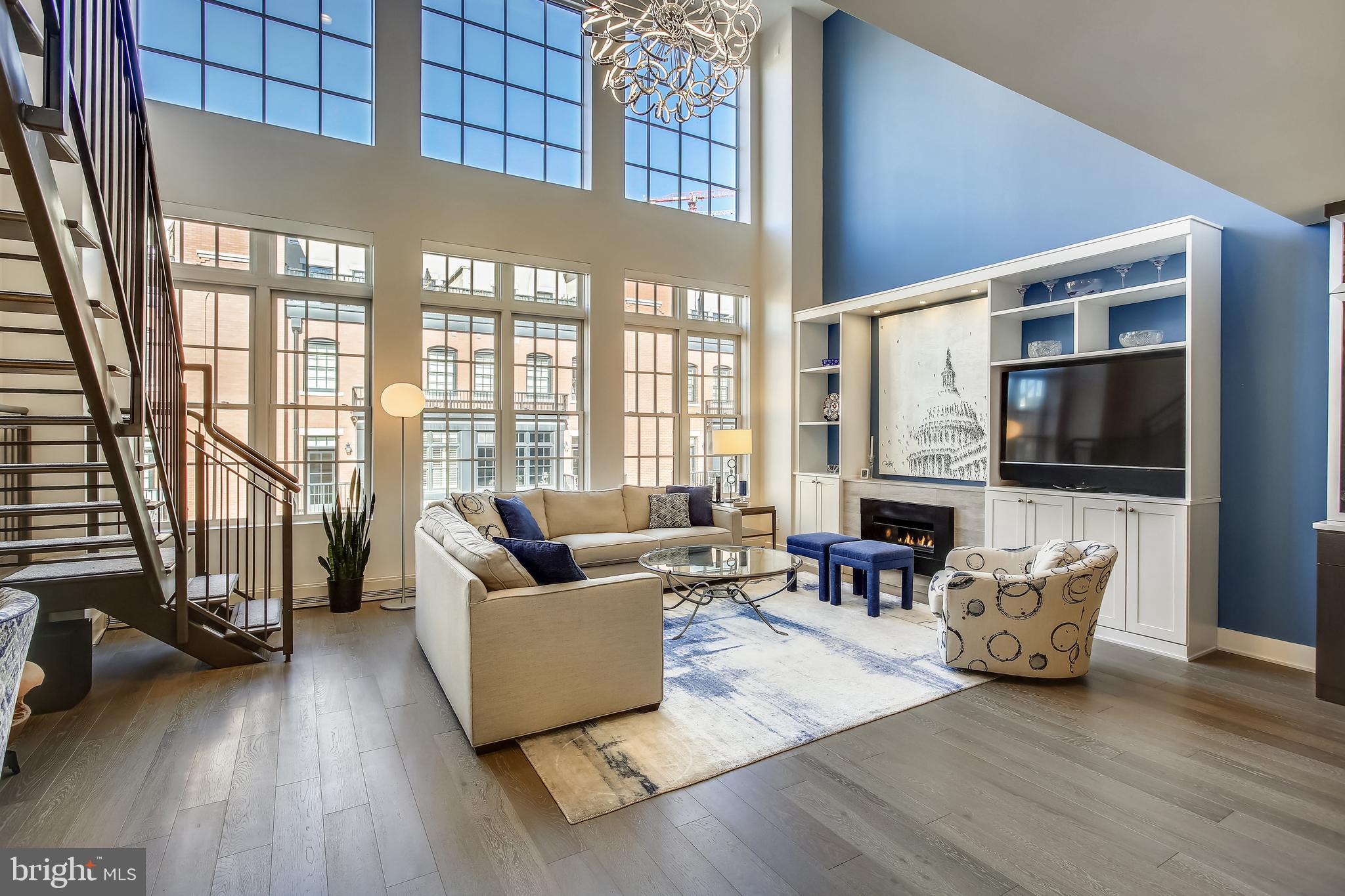2 Story Penthouse at The Select at Gaslight Square offers modern comfort & luxury!  Direct Elevator Access to both floors! Living Room w/19ft Vaulted Ceilings, Gas Fireplace, custom wall unit & Loft. Open Gourmet Kitchen with over-sized island/breakfast bar, 6 burner Wolf Stove & Subzero Refrigerator. Two Primary Suites! 2.5 Baths. Open Loft with Built-ins.  Private rooftop terrace with gas hookup for cooking, perfect for entertaining.  Large storage room, 2 assigned side-by-side parking spaces & Electric Car Charger. Conveniently located between Rosslyn and Courthouse Metros and minutes to DC!