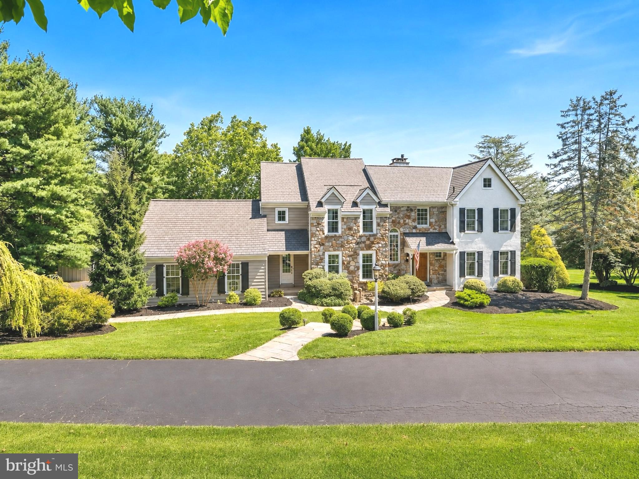Welcome to 1173 Shadow Oak Drive, a beautifully updated home set on 1.2 picturesque acres in the Malvern section of Tredyffrin Township and offering something increasingly hard to find; space, privacy and a truly spectacular setting. Backing to a deed-restricted farm, the home enjoys incredible privacy and beautiful views from nearly every room, with oversized windows framing the surrounding landscape like a picture.

Step inside through the dramatic two-story foyer, where a turned staircase and hardwood floors set the tone for the spaces ahead. The open sightline carries all the way through the soaring two-story family room to the beautiful grounds beyond, immediately connecting the home to its one-of-a-kind setting.
The first floor offers an ideal balance of traditional spaces and easy everyday flow, with gracious formal living and dining rooms along with a private office featuring its own gas fireplace. At the heart of the home, the impressive two-story family room is anchored by a floor-to-ceiling fireplace, while French doors open directly to the expansive rear deck, creating a seamless transition outdoors for dining, entertaining or simply enjoying the privacy of the property.
The beautifully renovated white kitchen is both timeless and functional, with quartz countertops, a six-burner cooktop, double ovens, a farmhouse sink and plenty of space to gather.

Upstairs, the primary suite feels like a true retreat, complete with cherry hardwood floors, a gas fireplace and multiple closets. The recently renovated primary bathroom is absolutely breathtaking and has been completely reimagined with stunning marble finishes, custom lighting and thoughtful details throughout. A freestanding soaking tub creates a beautiful focal point, while the oversized walk-in shower features intricate penny tile and an incredibly spacious design. A private water closet and double vanity complete the serene, spa-like space.
Also on the second floor, a spacious open loft creates an additional sitting area, homework space or flexible everyday living space. Three generously sized additional bedrooms share an updated hall bathroom with dual sinks.

The finished walkout lower level offers even more space to spread out, beginning with a cozy bonus space anchored by the home’s fourth gas fireplace. From there, the space opens into a separate game room with sliding doors leading directly outside, plus a dedicated exercise area, private office and full bathroom. Ample storage rounds out this functional extension of the home.
Outside, the expansive deck overlooks the lush, professionally landscaped grounds and neighboring preserved farmland, creating a backdrop that feels peaceful, private and one-of-a-kind.
All of this is set within the award-winning Tredyffrin-Easttown School District, with convenient access to Valley Forge National Historical Park, the shops and restaurants of the Main Line and King of Prussia, and major roadways including Route 202 and the Pennsylvania Turnpike. Paoli Station is also nearby, offering SEPTA Regional Rail service as well as Amtrak's Keystone Service with direct service along the Philadelphia–New York corridor; making both everyday commuting and trips to New York incredibly convenient.
Beautifully updated, meticulously maintained and set against a backdrop that simply can’t be recreated, 1173 Shadow Oak Drive is the rare kind of home that gives you everything: space, privacy, beauty and a setting you’ll never want to leave!