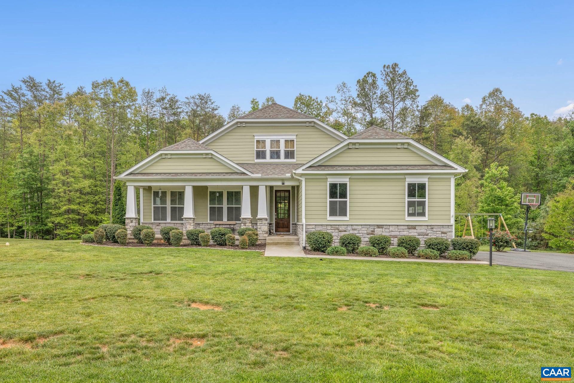 First-floor living, a true gourmet kitchen anchored by an oversized island, and seamless indoor-outdoor flow define this thoughtfully designed residence. Set on an expansive, private homesite just 12 miles from downtown Charlottesville.  The main level is anchored by a well-appointed primary suite featuring a spa-inspired bath with soaking tub, tile shower, and a generous walk-in closet. Hardwood floors carry through the main living areas, enhancing the open-concept layout. The spacious great room features an indoor/outdoor gas fireplace and flows into a dining area overlooking wooded views, all opening to a screened porch?creating an effortless extension of the living space.  Upstairs, a large bonus/family room offers exceptional flexibility, complemented by a private bedroom and full bath?ideal for guests, a home office, or additional living space.  Enjoy over 10 acres of Rivanna River frontage within the neighborhood, with opportunities to kayak, fish, and unwind. A rare combination of privacy, design, and proximity.,Granite Counter,Painted Cabinets,Fireplace in Great Room