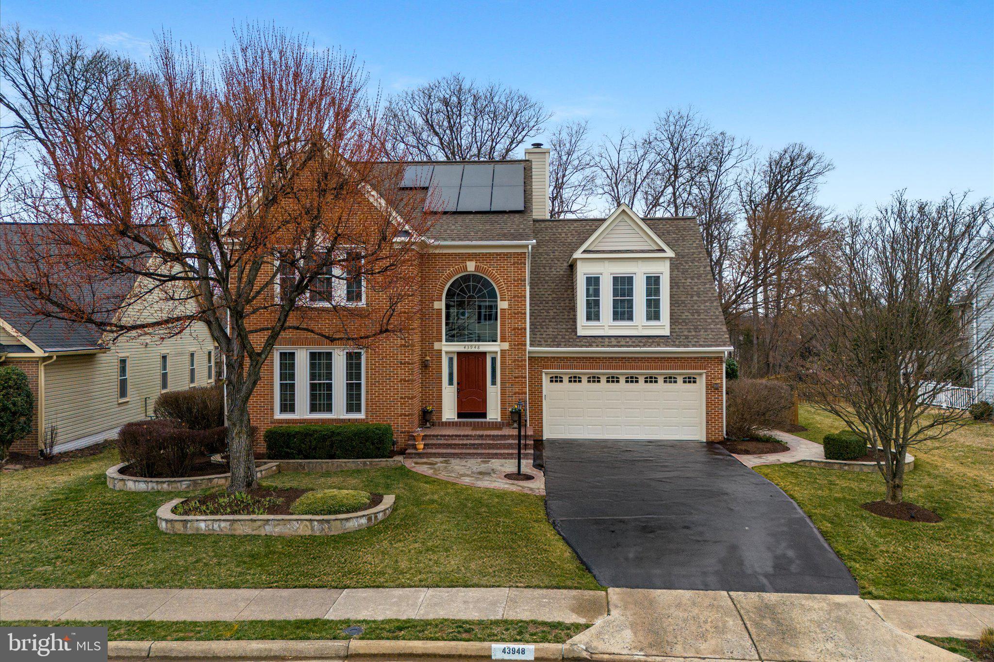 Beautiful SFH in the heart of Ashburn Village.  Meticulously updated by the original owners and in impeccable condition. As you step into the light-filled foyer, you will notice the cherry hardwood floors that continue throughout the main level and the upstairs foyer.  The living room and dining room are spacious for entertaining, and all the windows allow the natural light to shine in.  The gourmet eat-in kitchen has granite countertops, cherry cabinets, stainless steel appliances, and a double oven stove.  The family room has a gas fireplace and recessed lighting. The gorgeous three-season room has insulated wood tile flooring, EZ Breeze vinyl windows, and two Bromic heaters. This room is perfect for enjoying backyard views, changing seasons, and mature trees. The laundry room and half bath complete this level.  Upstairs, the primary bedroom is spacious and has an en-suite bathroom with a soaking tub, double vanities, a separate shower, and a walk-in closet. Three additional bedrooms, one being a princess suite and a Jack N Jill full bath, provide plenty of room for family and guests.   The fully finished lower level has a family room, stone gas fireplace, den/office, custom cherry bar, a full bath with sauna, and a built-in 50's style banquette. Large fenced backyard backs to woods with stone fireplace and two stone patios with wall seating.  Plus, the property is beautifully landscaped and has a full-yard irrigation system and outdoor lighting.  You're moments away from incredible amenities, including lakes, walking trails, five pools (one indoor), tennis/pickleball courts, a health club, and the W&OD trail.  Updates include Solar panels (2023), Hot Water Heater (2018), HVAC (2018 20 SEER High-efficiency Dual Fuel unit with a steam humidifier and UV Bulb System), JD Power Certified Simonton Windows (2012), Roof (2002), Siding (2002) and Gutters (2002). Welcome Home!
