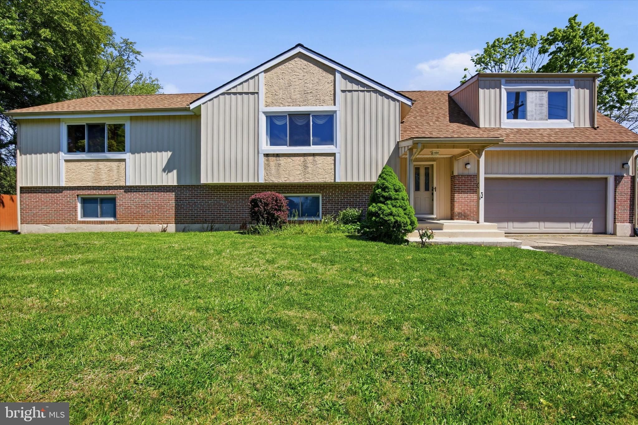 A charming, well constructed, and well cared for split level home that includes a detached 700 square foot "office space". This unique Bucks County home sits on 0.62 acres and offers the convenience of being close to town but also the feel of being a little off the beaten path. The 6 bedrooms and 3.5 bathrooms in the roughly 2500 square foot main dwelling offer plenty of space for a larger family. The bottom level comes fully equipped with its own bathroom and kitchen area. The porch swing on the back deck is the perfect place to enjoy a morning cup of coffee, while the garage offers plenty of room for storage or whatever projects you may have. The main house has a new roof and furnace. The spacious detached unit out back offers many potential opportunities for use. Additionally, the property offers a primary driveway, as well as a shared driveway with the neighbor.