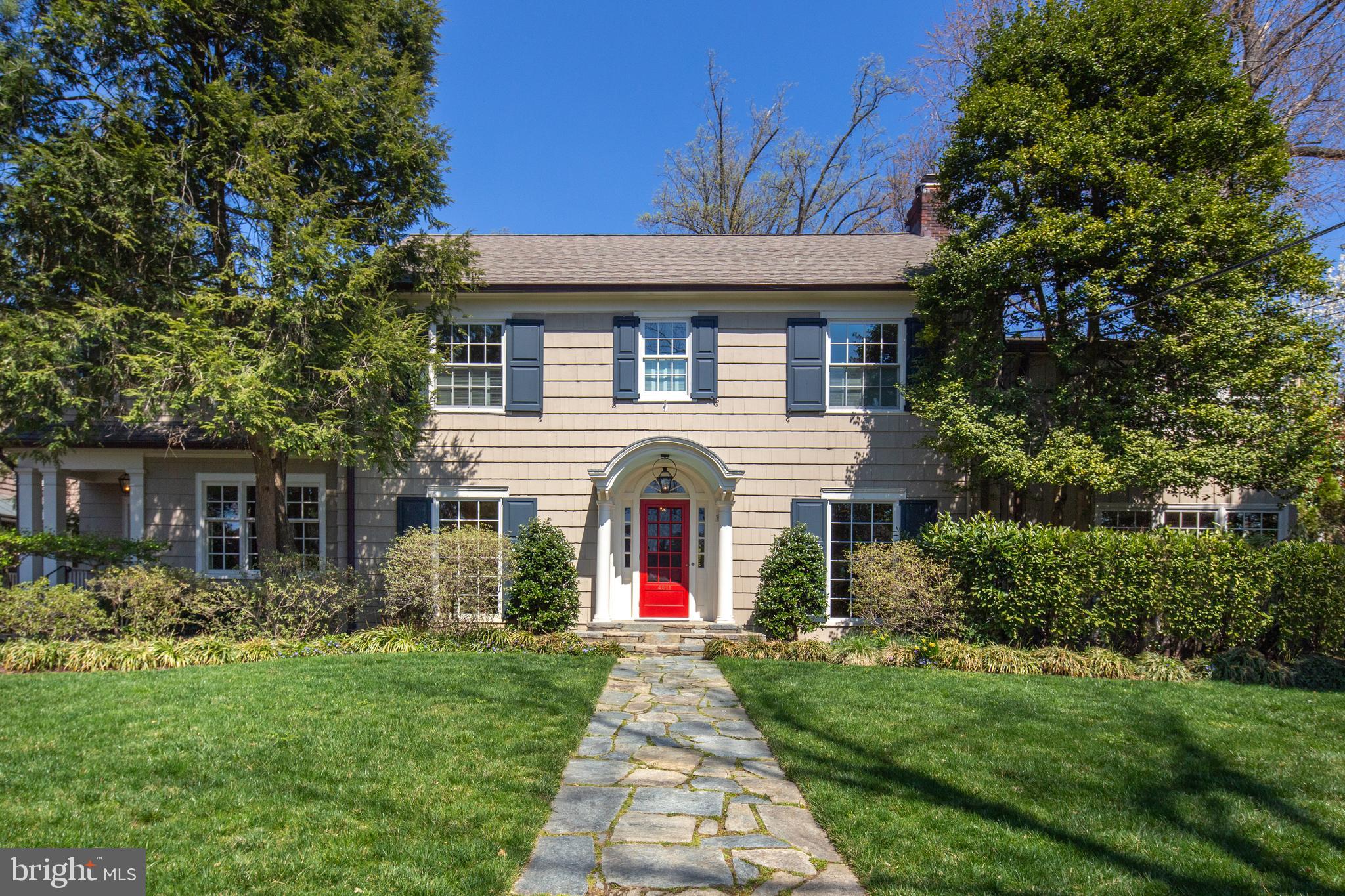 Welcome to a beautifully updated and gracious Wesley Heights colonial sited on an enviable lot near the top of Foxhall Road. Understated elegance is a theme of this surprisingly large home with plenty of space for all types of entertaining: formal dinners, relaxed family gatherings, or garden and pool parties. The main level provides a foyer/entrance hall, living room with fireplace, family room with built-in shelving and a wet bar, powder room, dining room, breakfast room, and kitchen that opens to a sitting/study room. The custom kitchen includes a center island with breakfast bar, professional grade stainless appliances, and marble countertops, and a side entrance. A sunroom/gallery at the back of the house connects the main rooms to the garden and terrace and provides access to the lower level. The home's second level offers five bedrooms and four full baths plus a home office and laundry closet. The master suite area has a private balcony overlooking the garden, walk-in closet, and a spa-like bath with Waterworks fixtures, double vanity, separate shower and soaking tub. The top floor has as two additional bedrooms with a newer full bath. The lower level is currently used as a playroom and has a powder room, wine room, laundry room, and storage room. Behind the house is a large, fenced, private garden with swimming pool, patio and terrace space, and an outdoor kitchen with grill and refrigerator. The detached, oversized garage, built to accommodate a car lift, also offers a half bath to serve as a pool changing room.