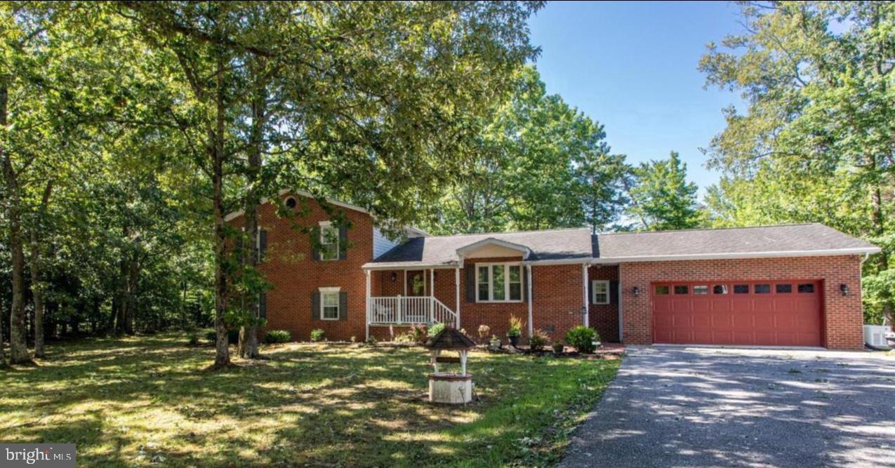 From the moment you step inside this well-maintained home offered by the original owner, you will fall in love with country living.  With its beautiful oak hardwood flooring, updated bathrooms, large custom kitchen with energy efficient appliances and granite countertops, great family room with a brick fireplace with a gas insert, plus a whole house generator, this home offers a fantastic home for that picky buyer. Relax at the end of the day in the light filled sunroom that leads to a deck, patio and screened-in gazebo. The back yard has plenty of space for a garden, play area or pool. This property can be easily used for a home-based business.  Owner/Agent